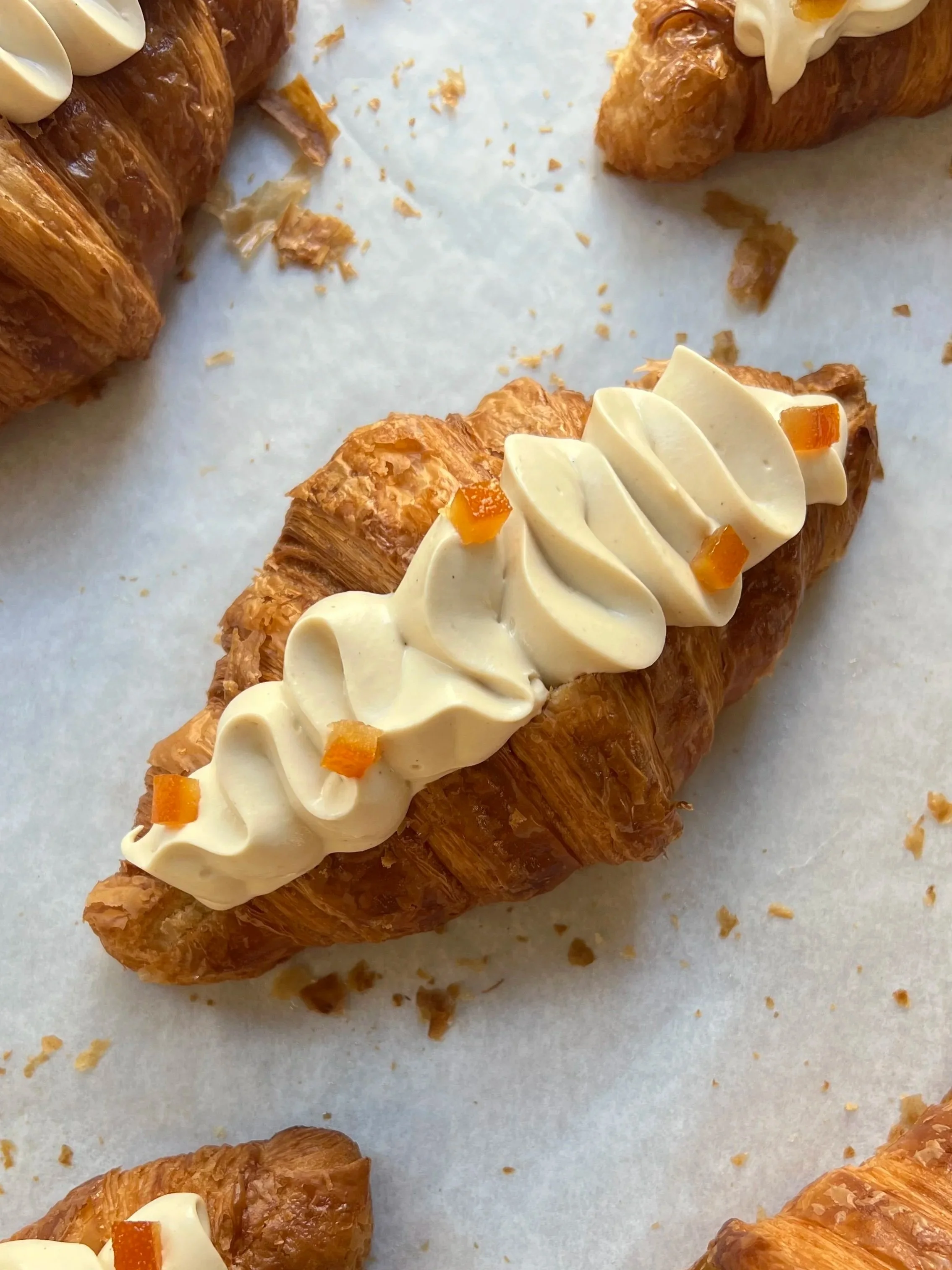 Orange and white chocolate filled croissant
