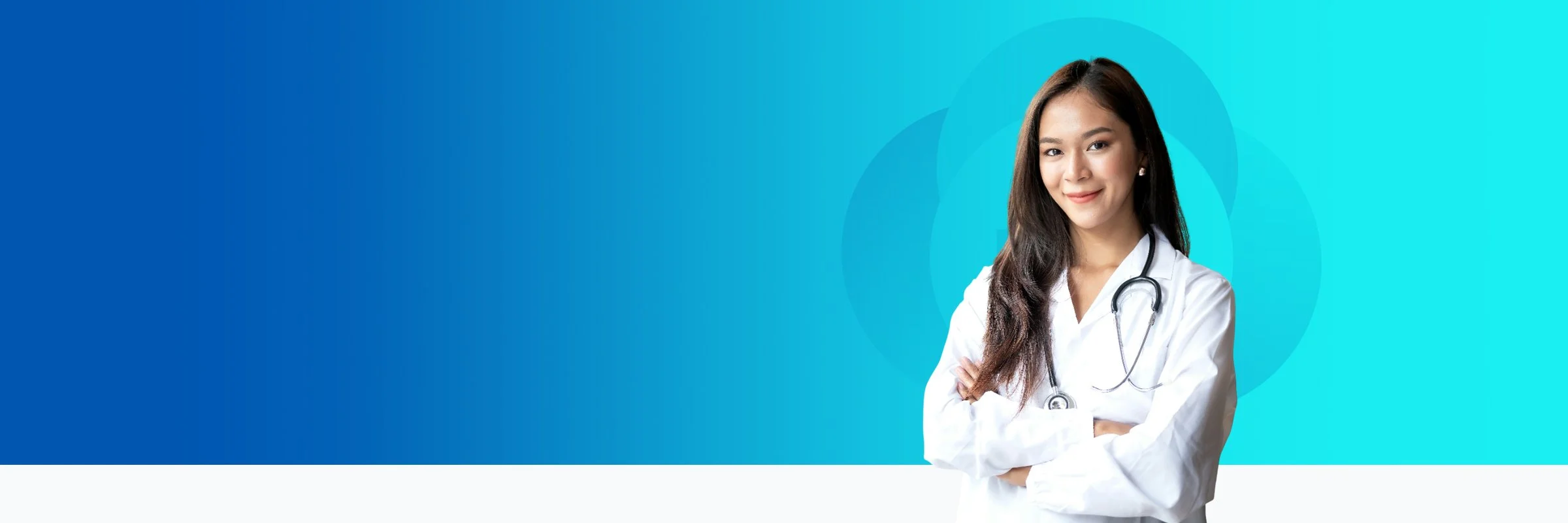 A young female doctor with long dark hair, smiling, wearing white coat and stethoscope standing with arms crossed against a blue gradient background.