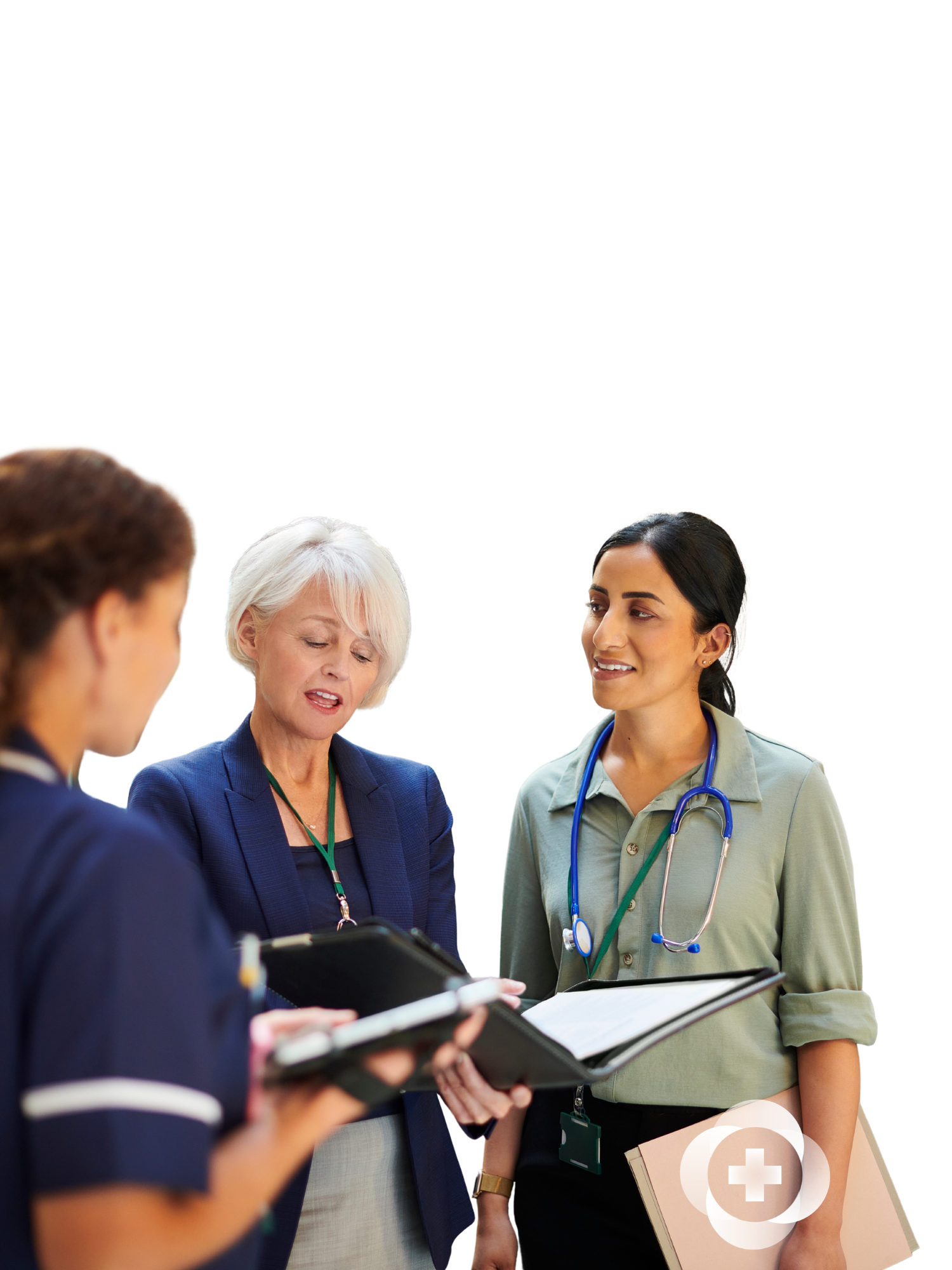 Group of medical professionals and a woman in business attire having a discussion in a hospital or clinic setting.