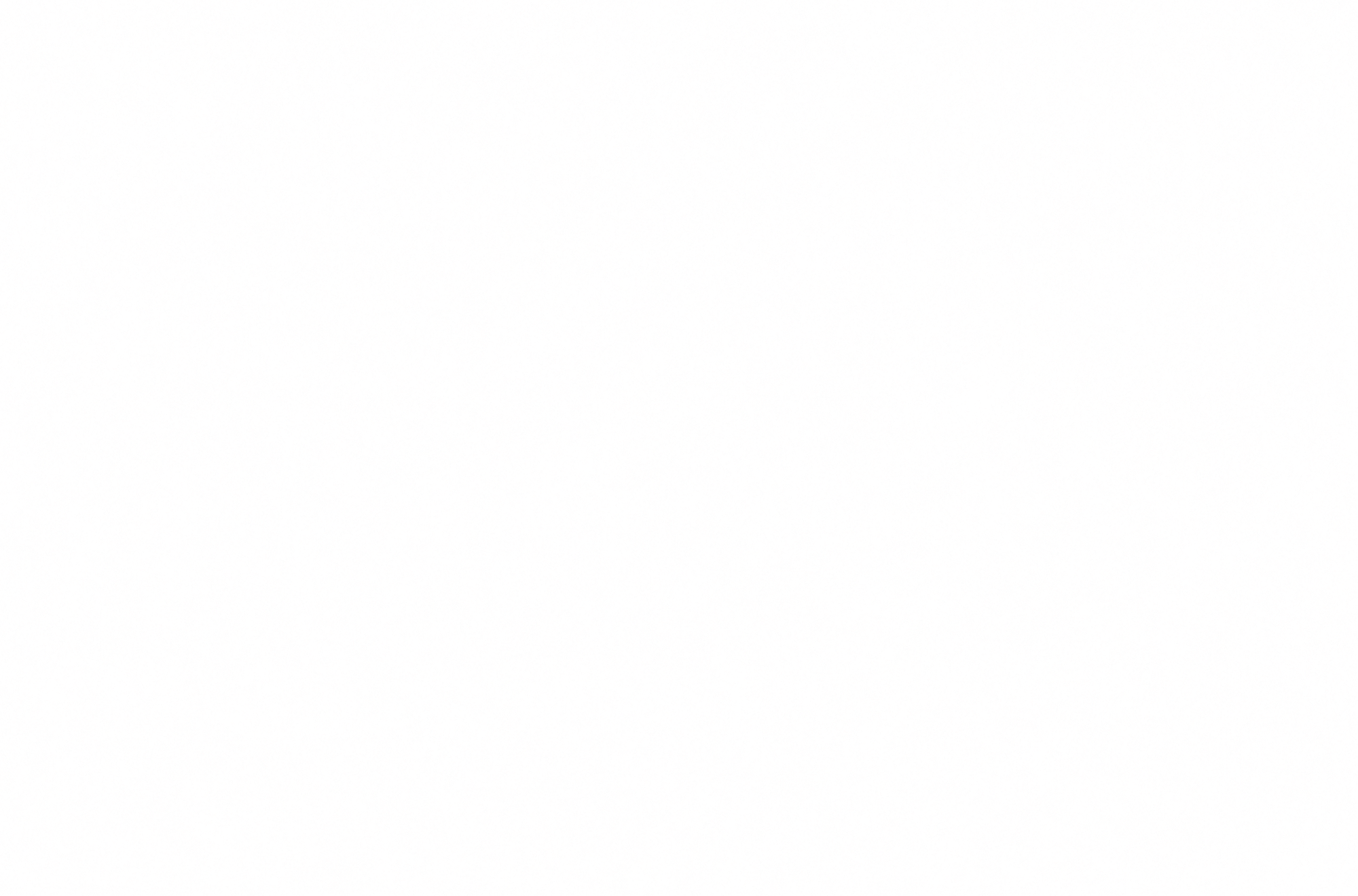 Close-up view of a textured, speckled surface with black, pink, and white granules.
