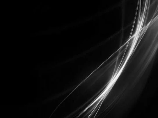 Abstract black background with white streaks of light.