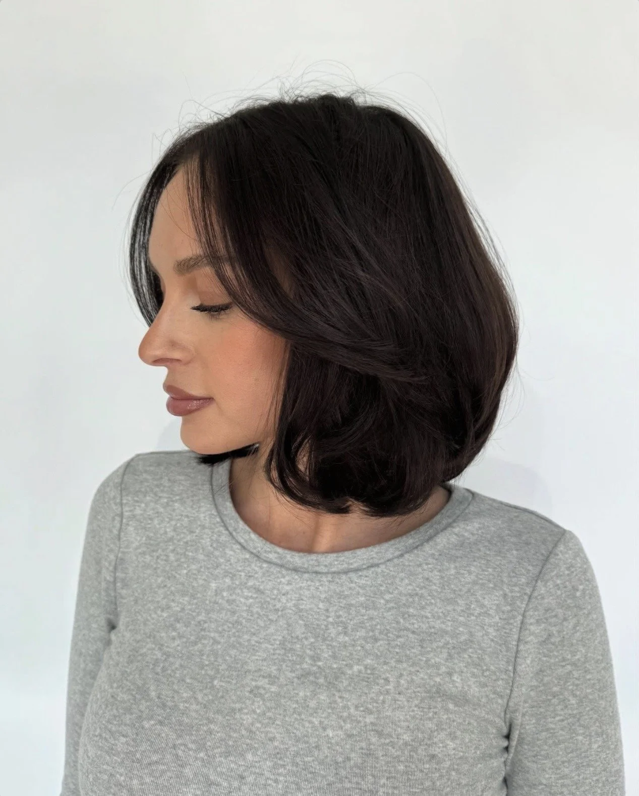Rich brunette color with a modern bob by Seventy Seven Hair Lounge in Alpharetta