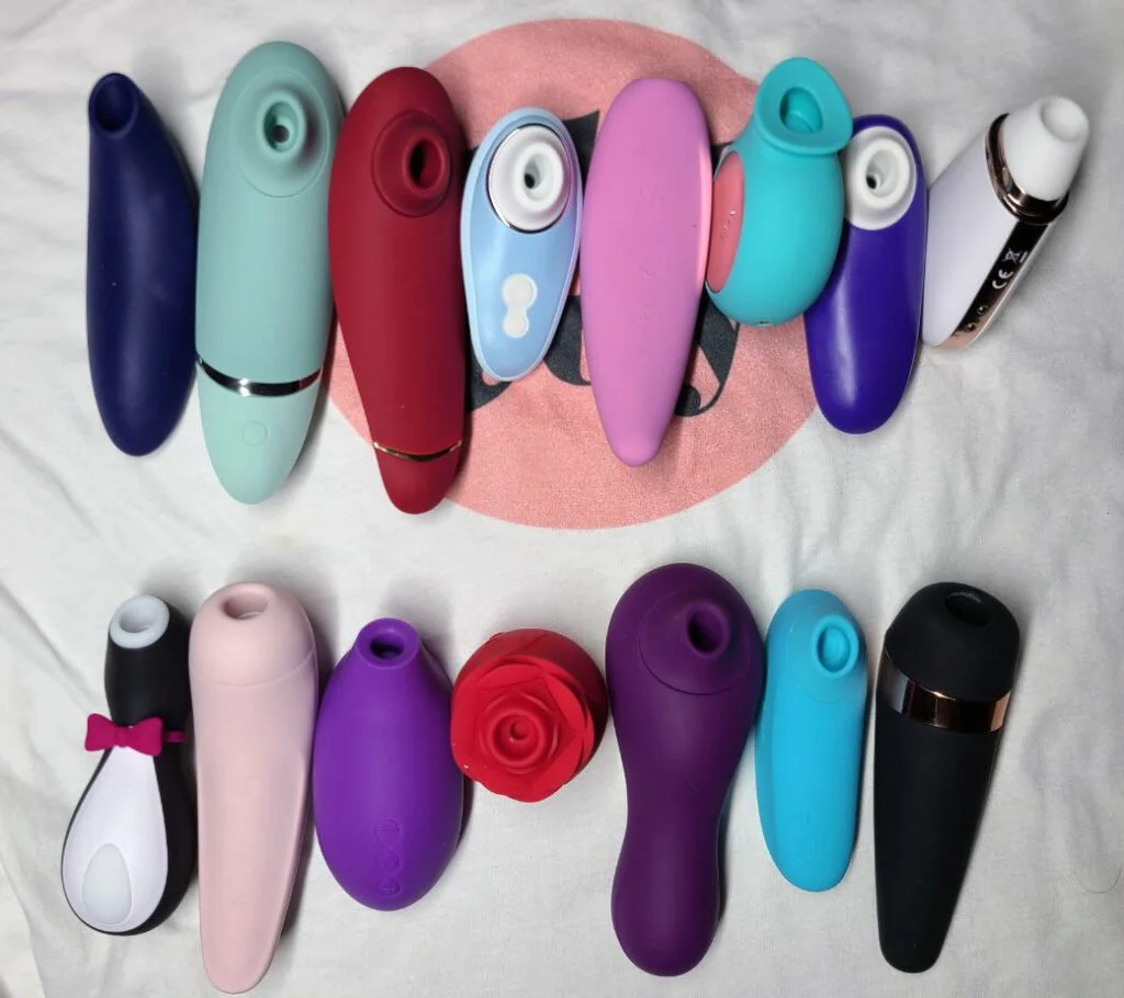 Various suction vibrators of different colors, shapes, and sizes.