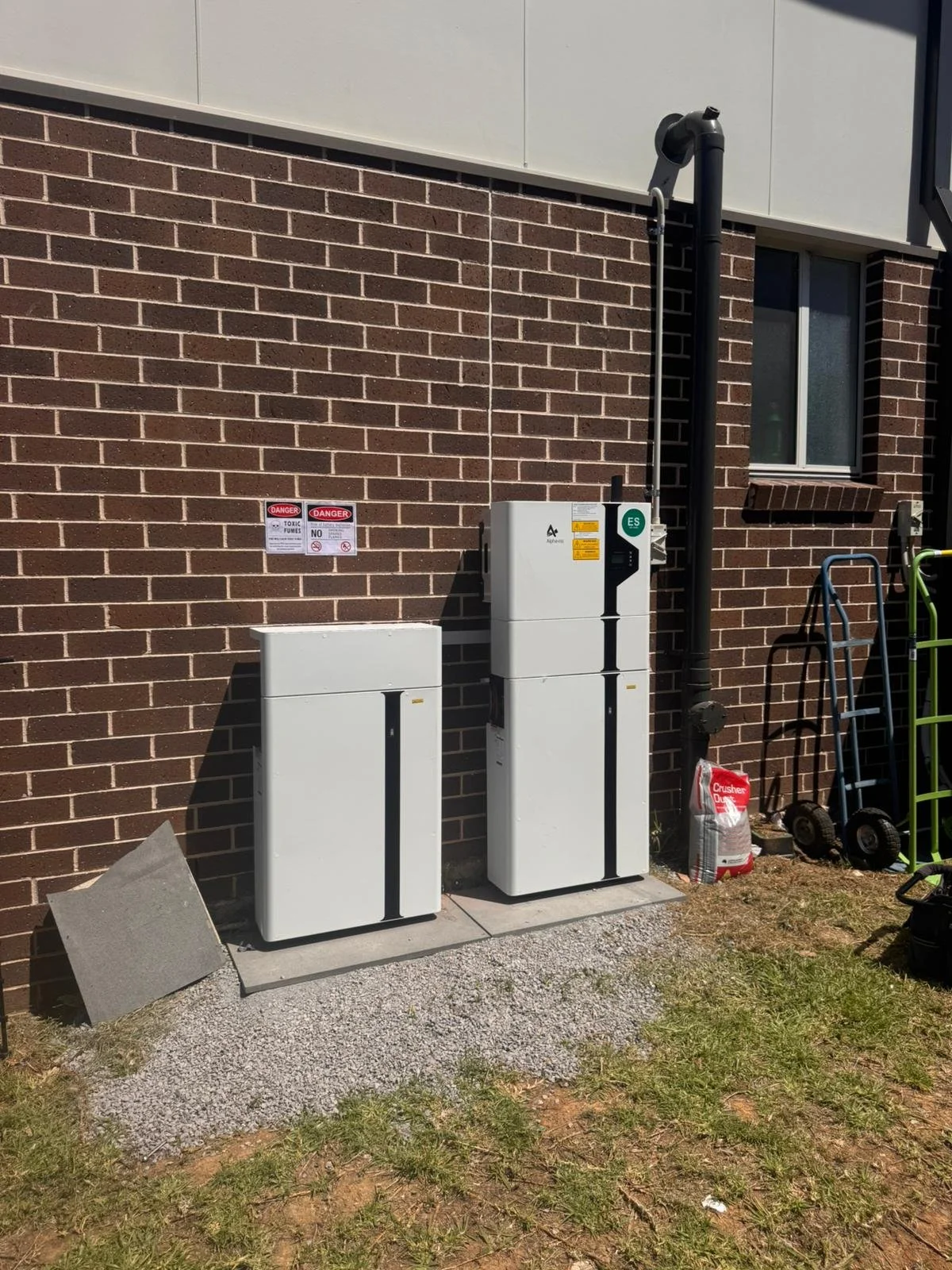 Large home solar battery storage system installed outside a house to store solar power for night use and energy independence.
