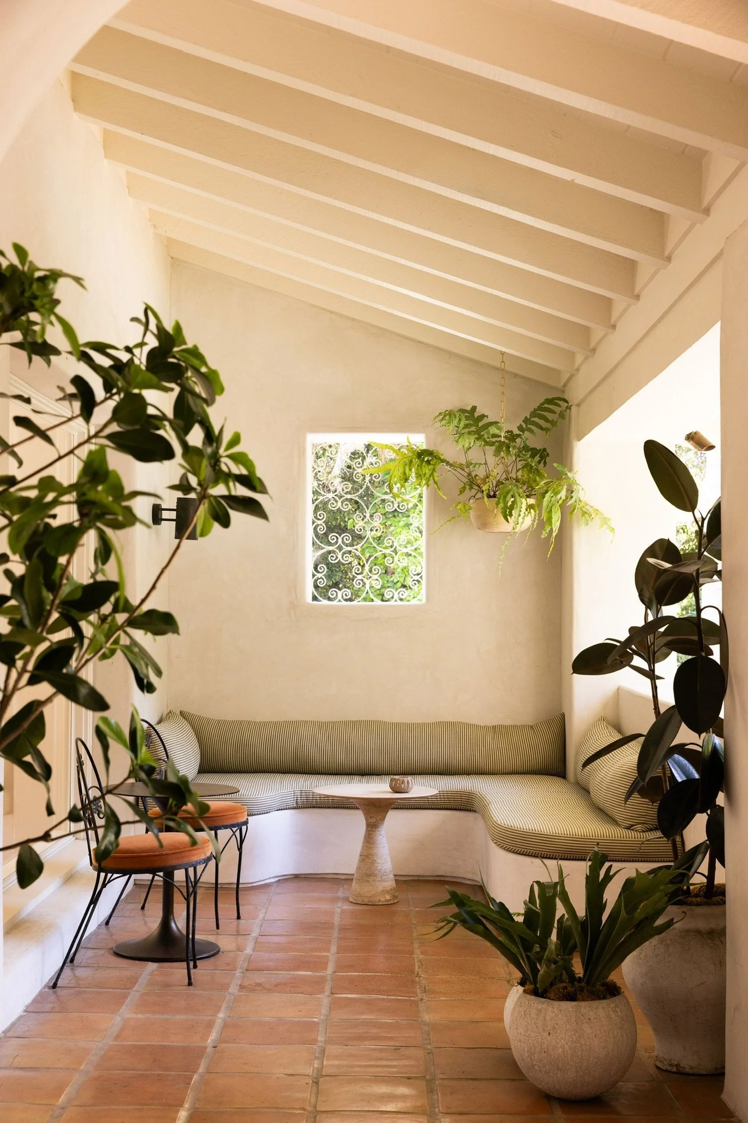 Restored Spanish Revival interior showcasing arched passageways and original architectural character in a Los Feliz residence.