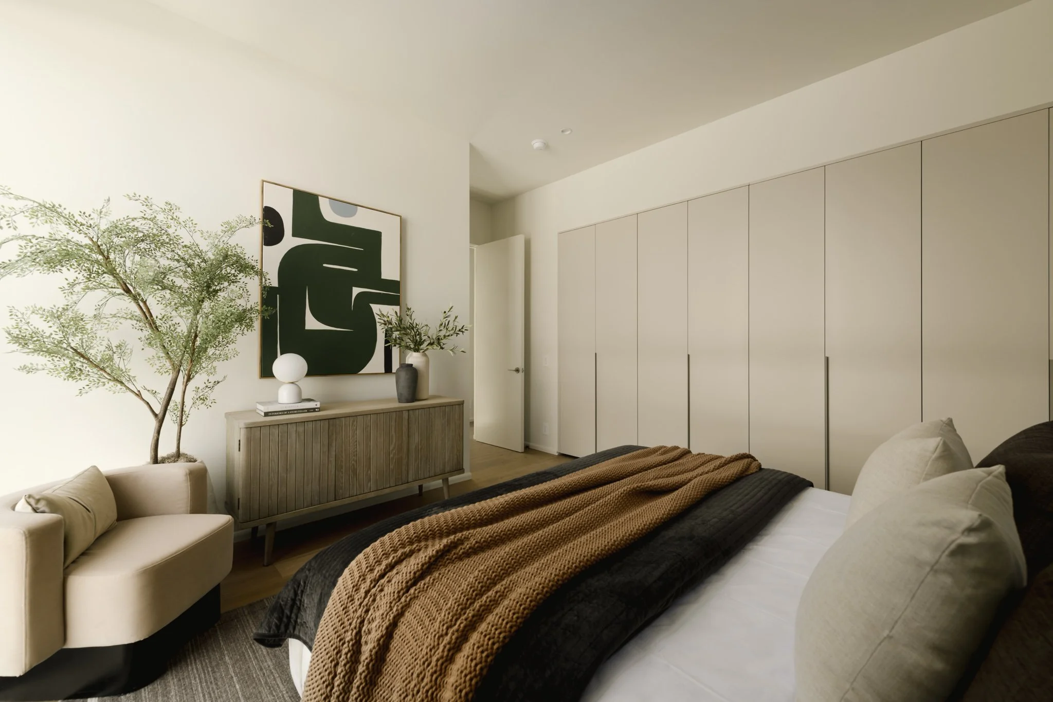 Primary bedroom featuring custom built-in wardrobes, contemporary finishes, and abundant natural light, completed by JBurton General Contractor for luxury townhomes in Silver Lake, Los Angeles.