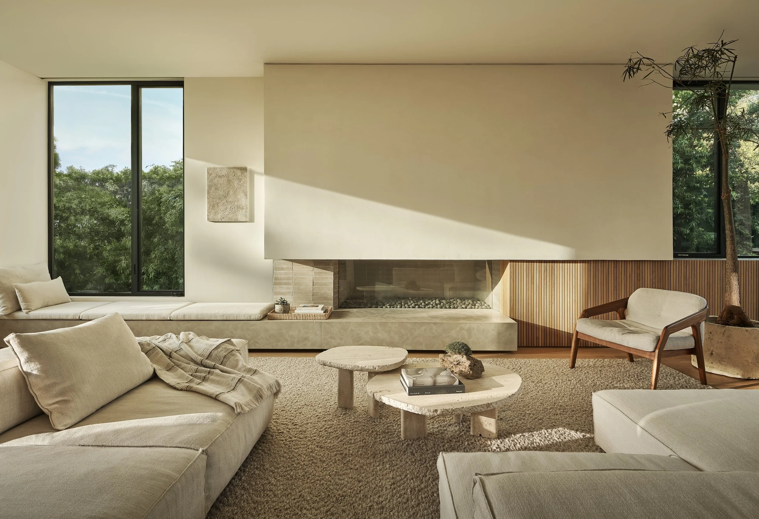 Contemporary lounge featuring a custom linear fireplace, warm wood finishes, and an open floor plan, remodeled by JBurton General Contractor in Beverly Crest, Los Angeles.