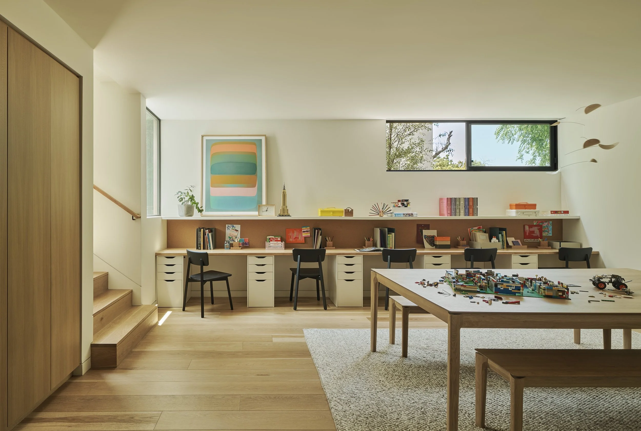 Custom children's study room with built-in workstations, play area, and modern design, remodeled by JBurton General Contractor in Westwood, Los Angeles.