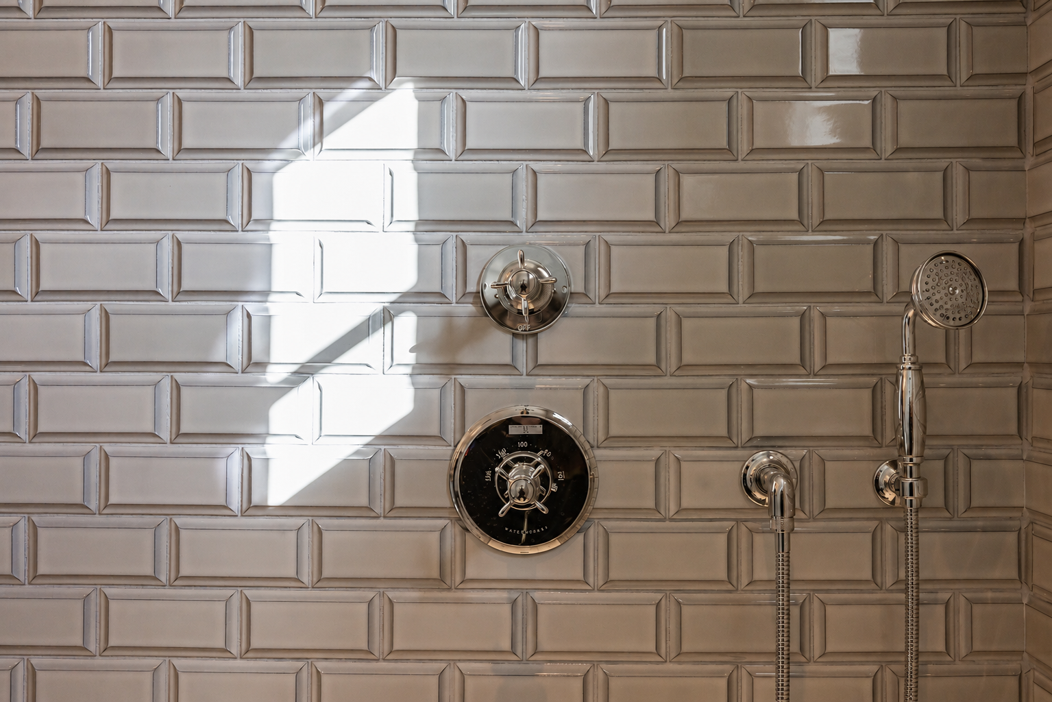 Classic subway tile shower detail with polished fixtures, remodeled by JBurton General Contractor in Hancock Park, Los Angeles.
