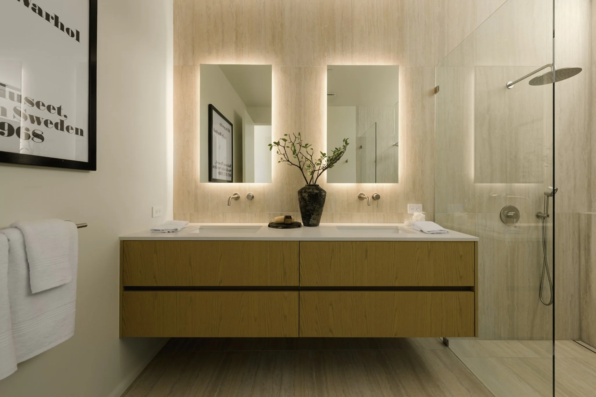 Primary bathroom featuring a floating double vanity, illuminated mirrors, and custom wood cabinetry, completed by JBurton General Contractor in Silver Lake, Los Angeles.