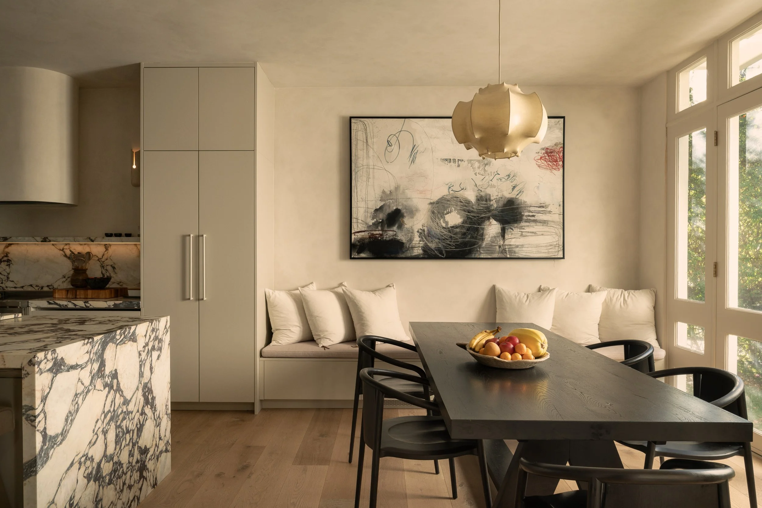 Dining area with custom built-in banquette seating and contemporary finishes, completed by JBurton General Contractor during a luxury home remodel in Benedict Canyon, Los Angeles.