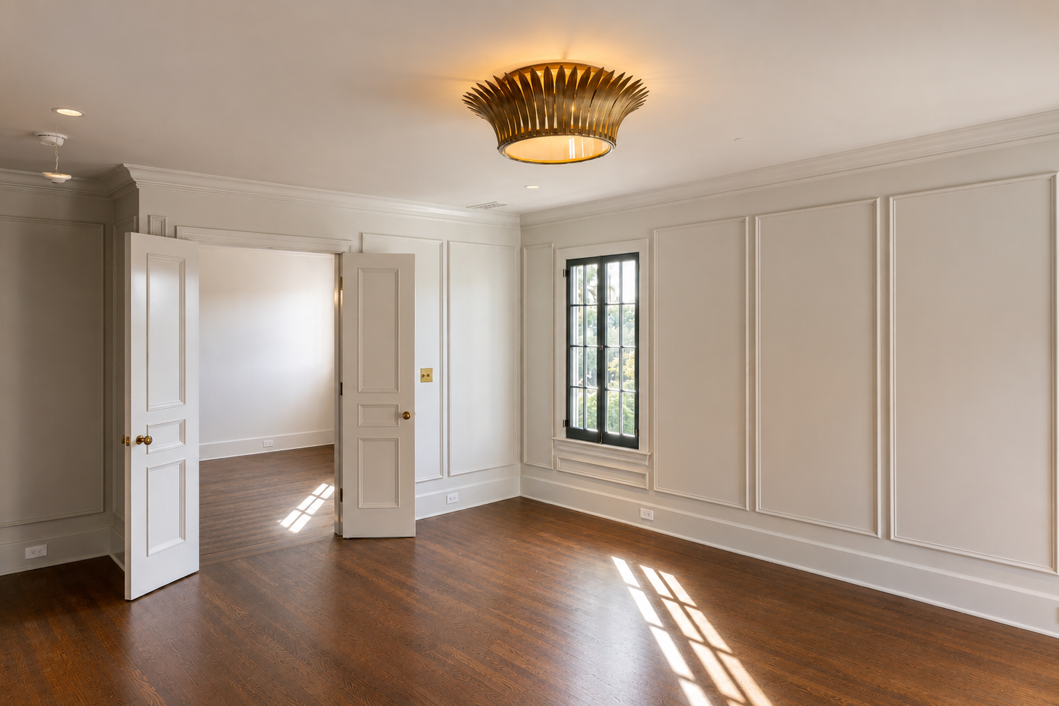 Restored bedroom with custom wall paneling, hardwood floors, and traditional finishes, remodeled by JBurton General Contractor in Hancock Park, Los Angeles.