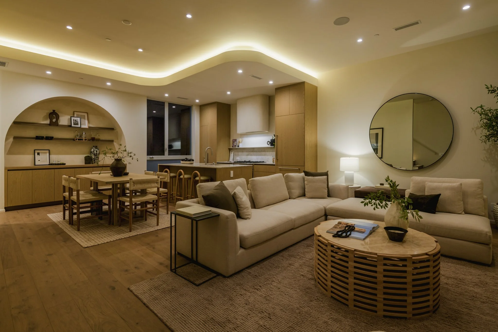 Open-concept living room with custom ceiling lighting, seamless connection to the kitchen, and contemporary finishes, completed by JBurton General Contractor in Silver Lake, Los Angeles.