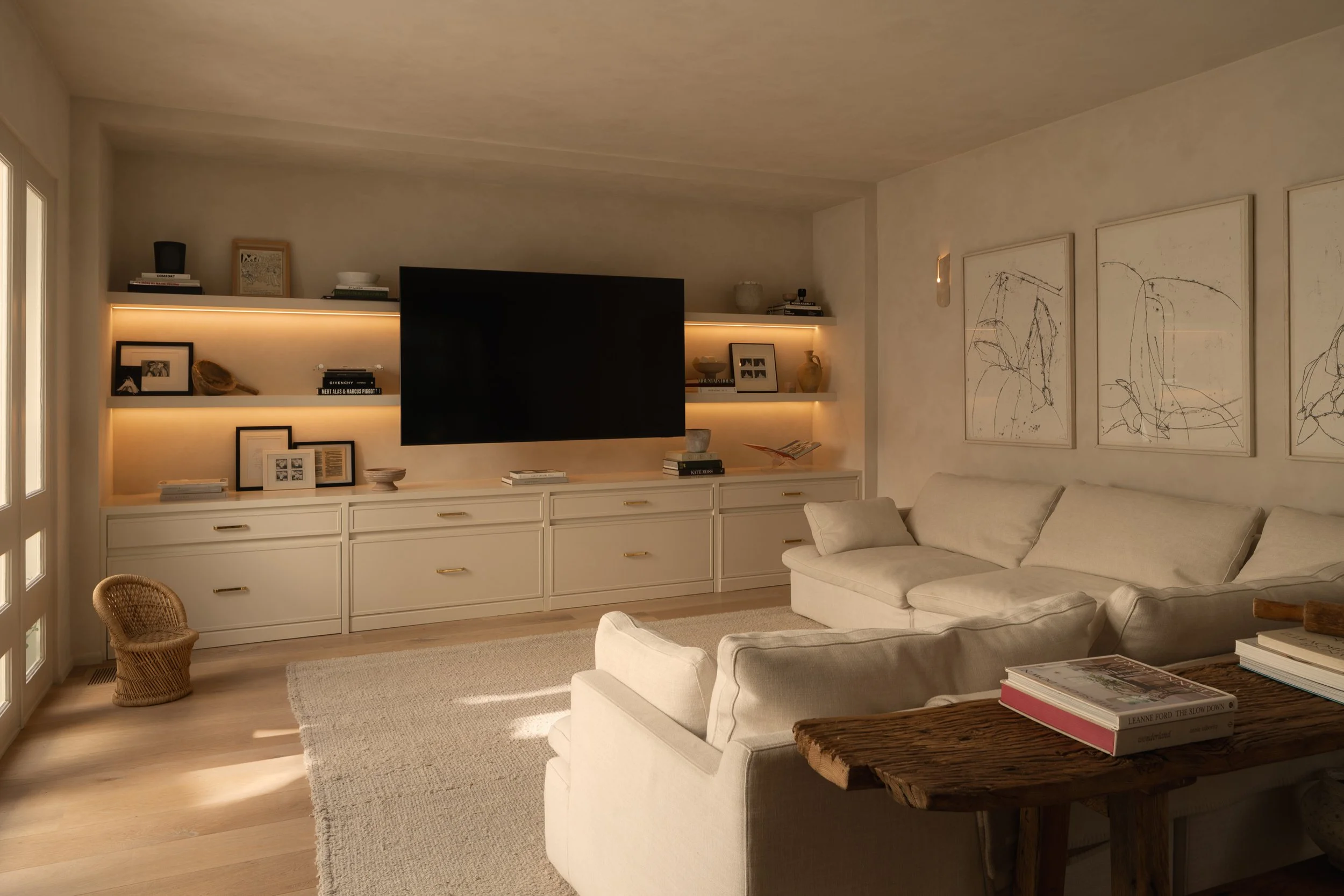 Custom media room with built-in cabinetry, integrated lighting, and a contemporary lounge area, completed by JBurton General Contractor in Benedict Canyon, Los Angeles.