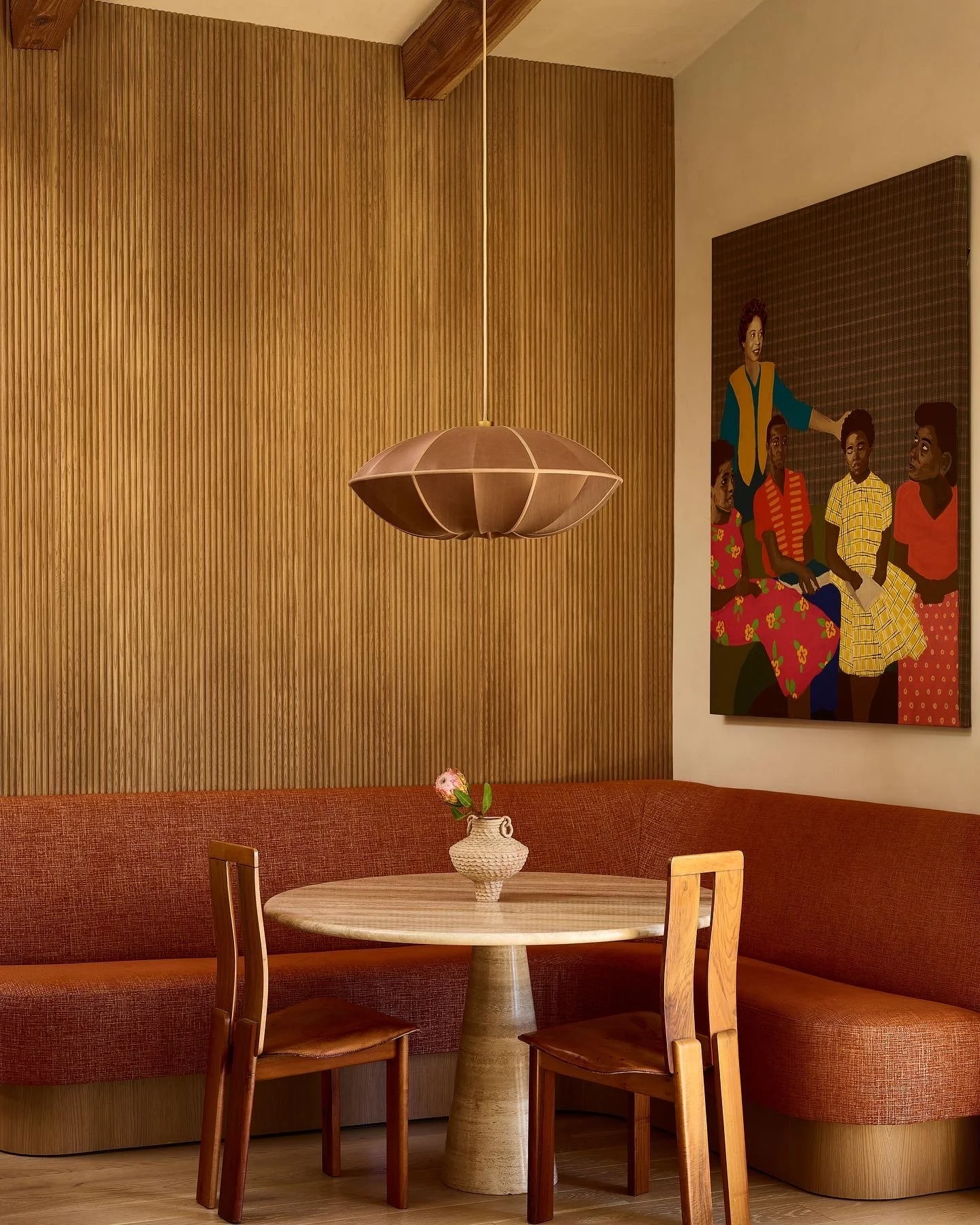 Custom breakfast nook with built-in banquette seating and wood-paneled walls, remodeled by JBurton General Contractor in Hollywood Hills, Los Angeles.