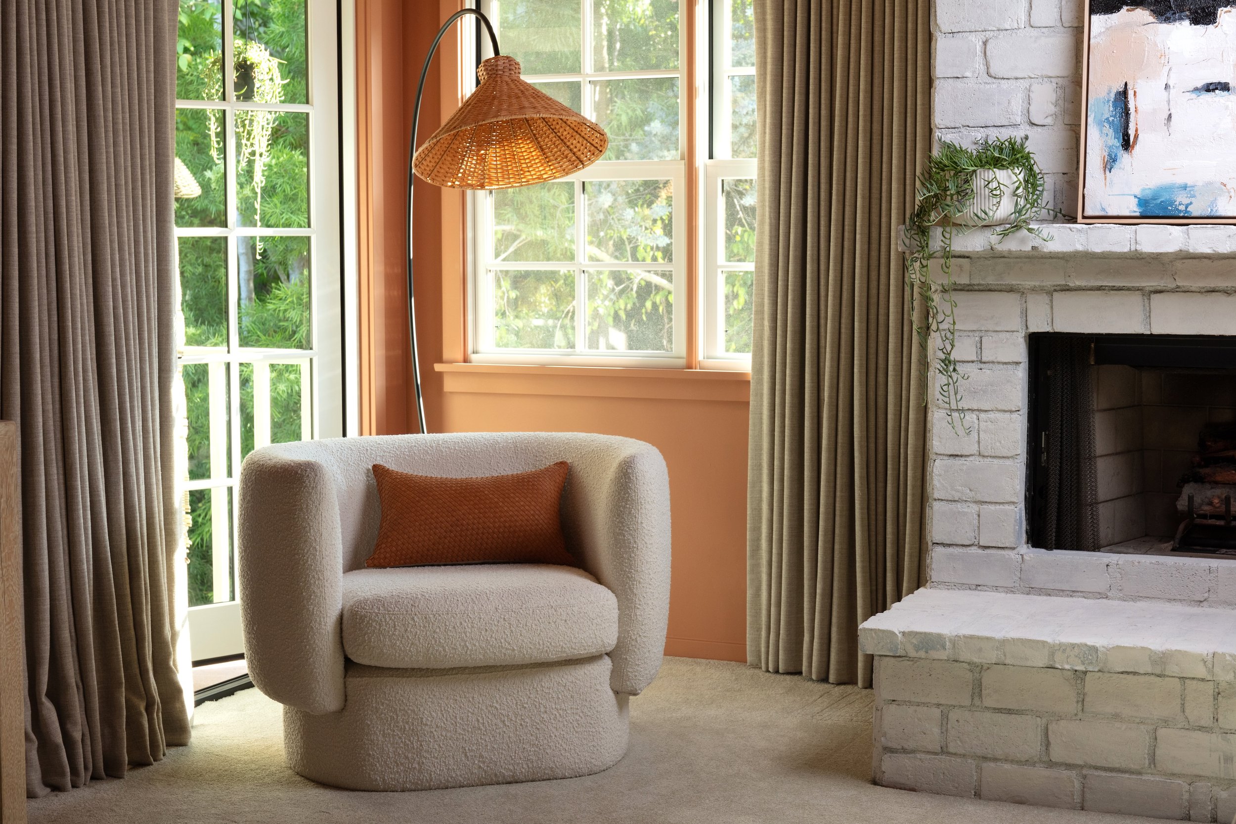 Cozy seating area with custom windows, natural light, and warm contemporary finishes, completed by JBurton General Contractor during a Brentwood home remodel.