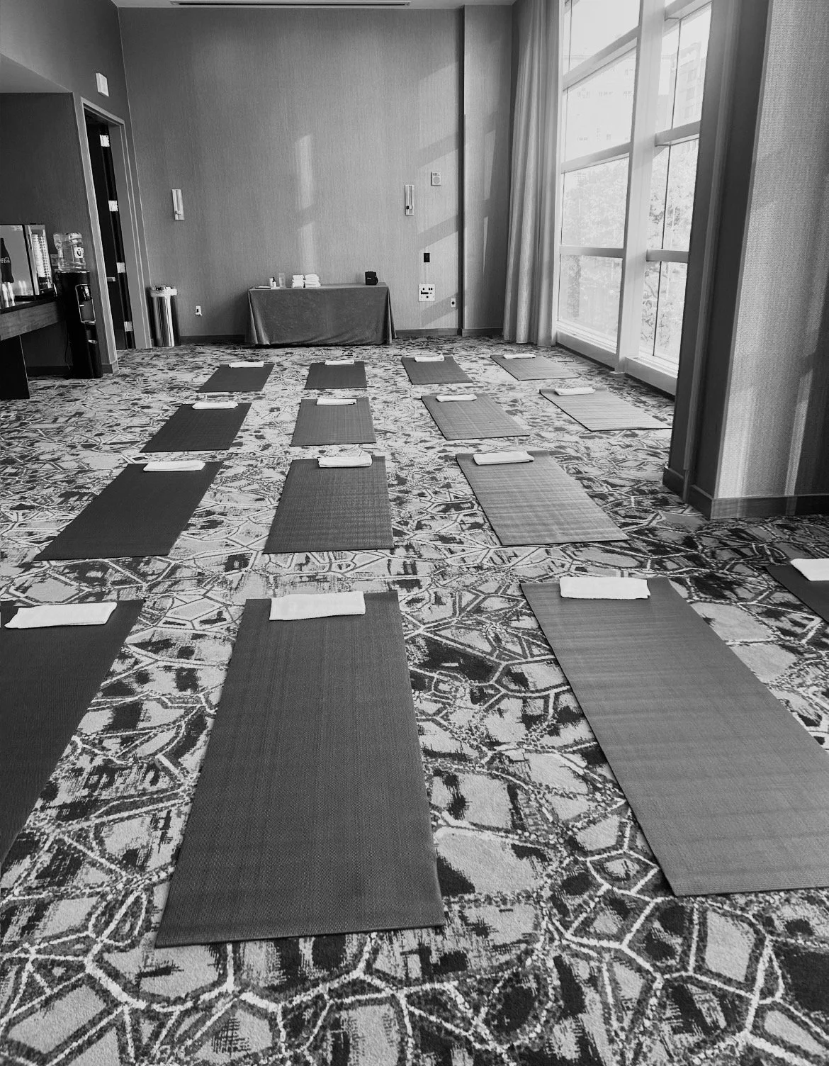 Yoga mats arranged for a conference wellbeing session