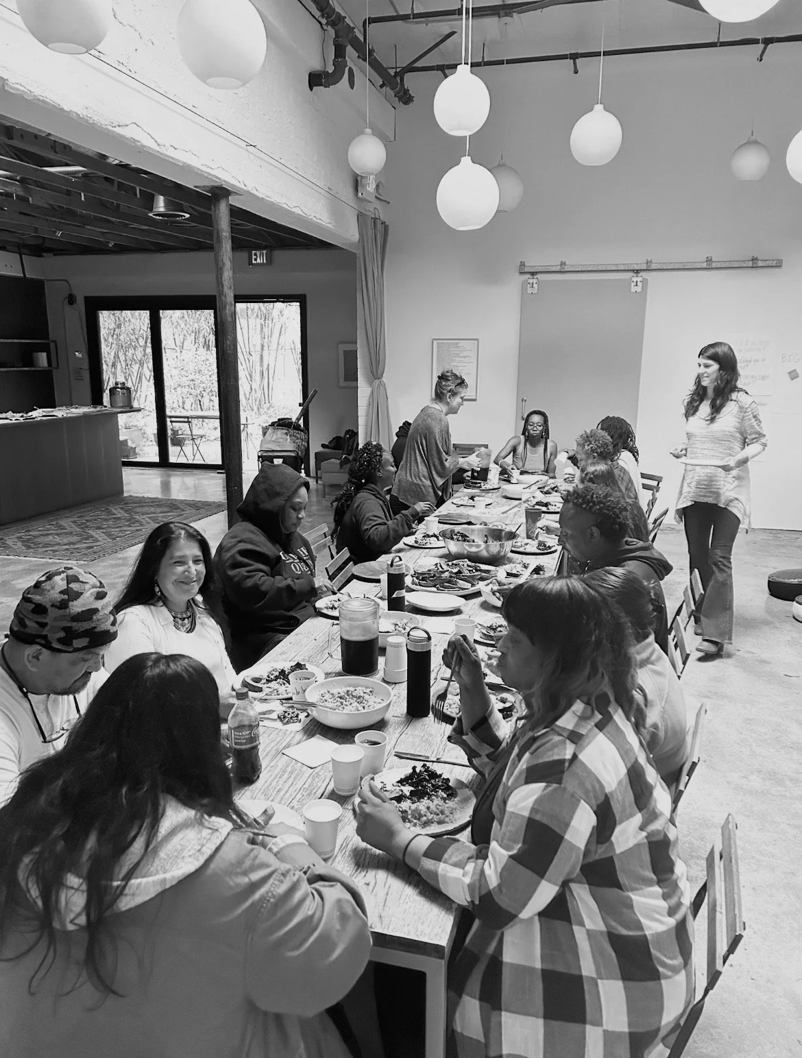 Community members sharing a meal together indoors