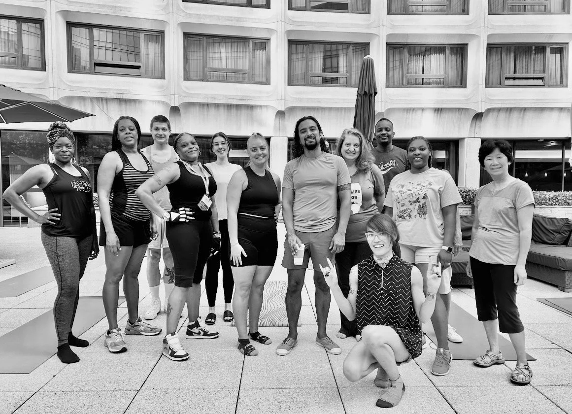 Group of conference wellbeing session participants outdoors
