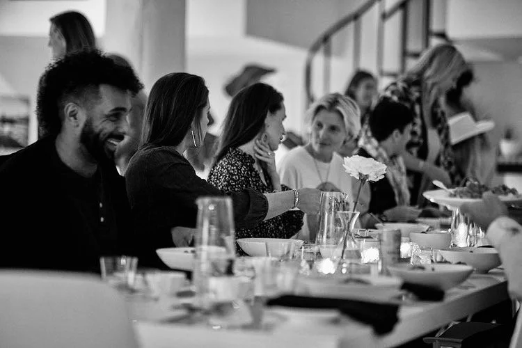 People sharing a meal and connecting at a community gathering