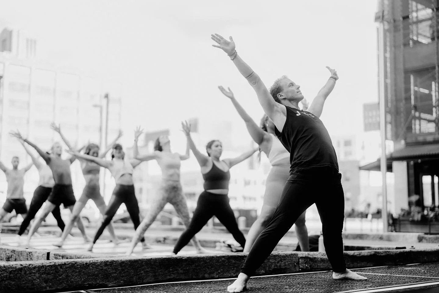 Group yoga session in an urban outdoor space
