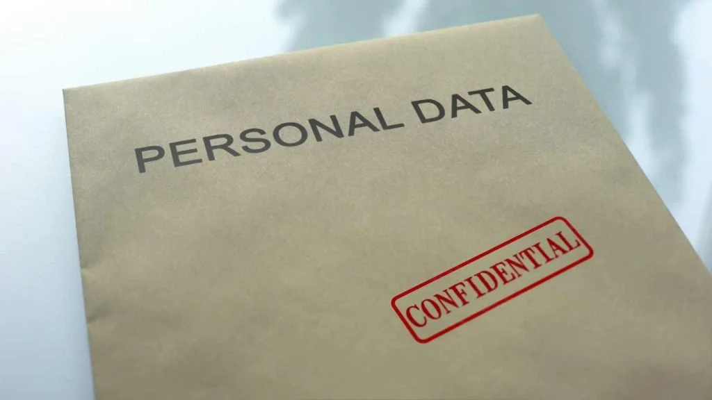 A file folder labeled 'Personal Data' with a red 'Confidential' stamp.