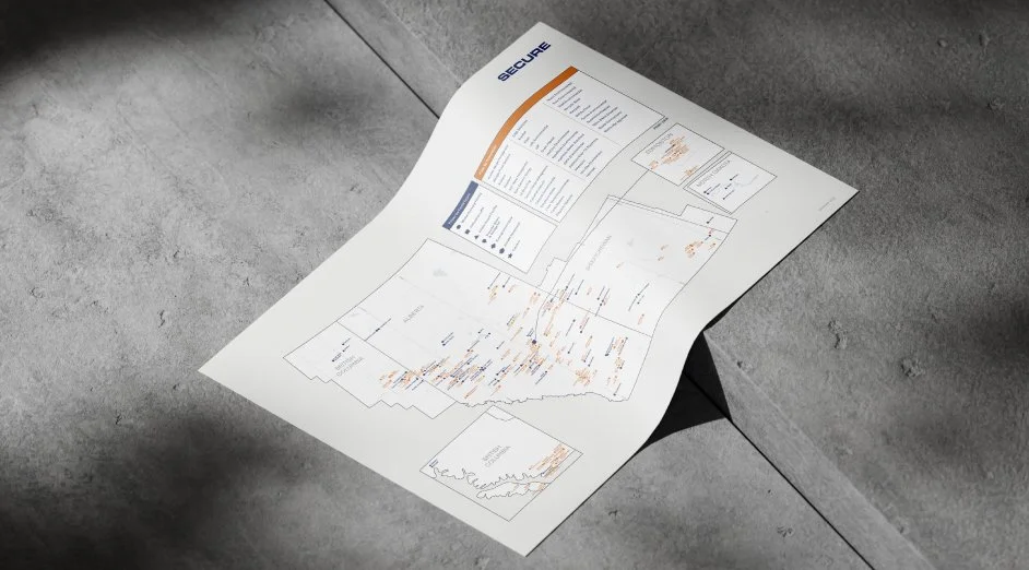 A printed document titled 'SECURE' with various charts and graphs, partially folded, placed on a concrete surface.