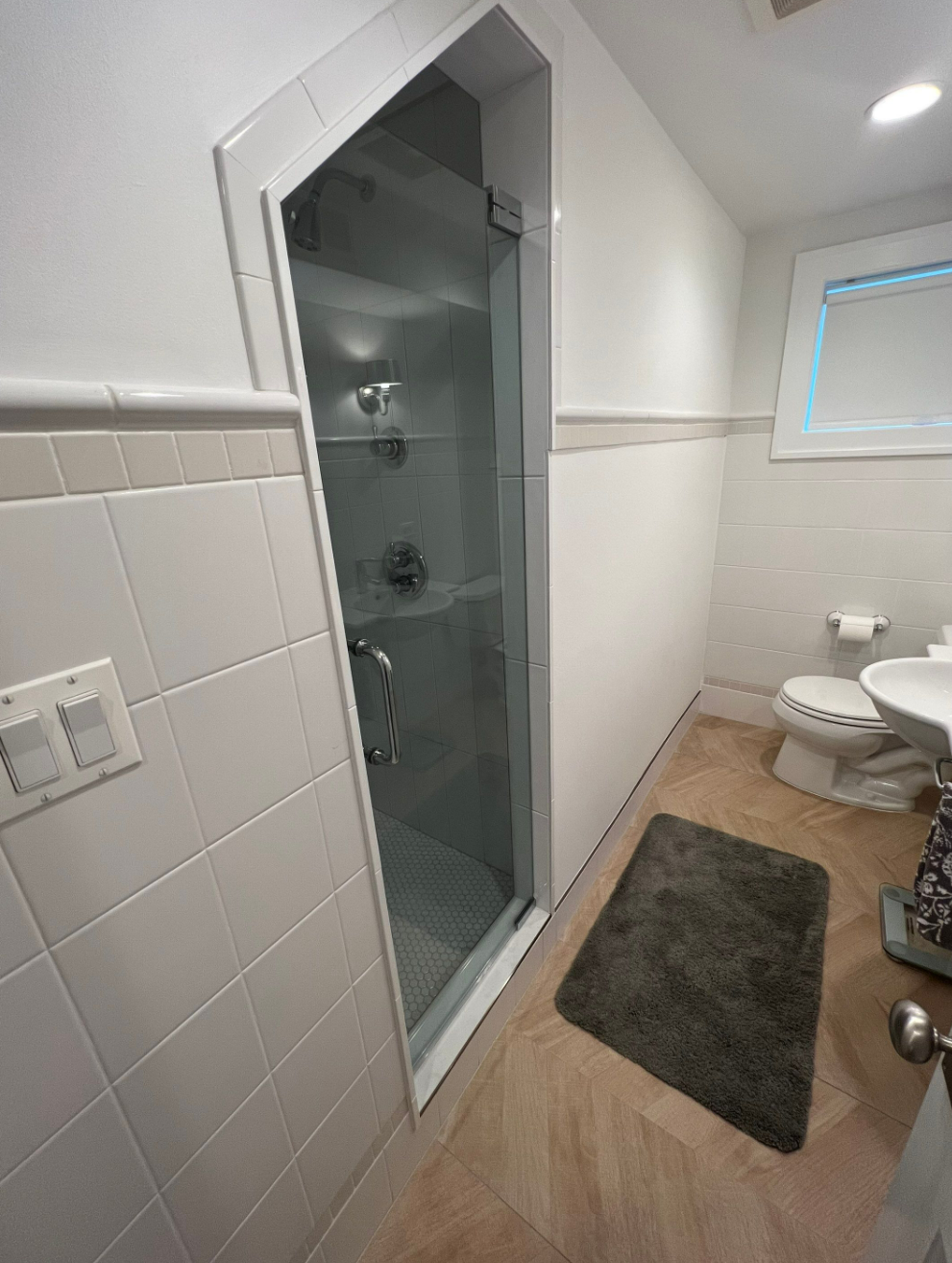 bathroom renovation with Scandinavian style, chrome plumbing, white subway tile, white penny tile, wood-looking tile on built-in bench and shelf with glass door
interior designer chicago
interior design chicago
bathroom design chicago