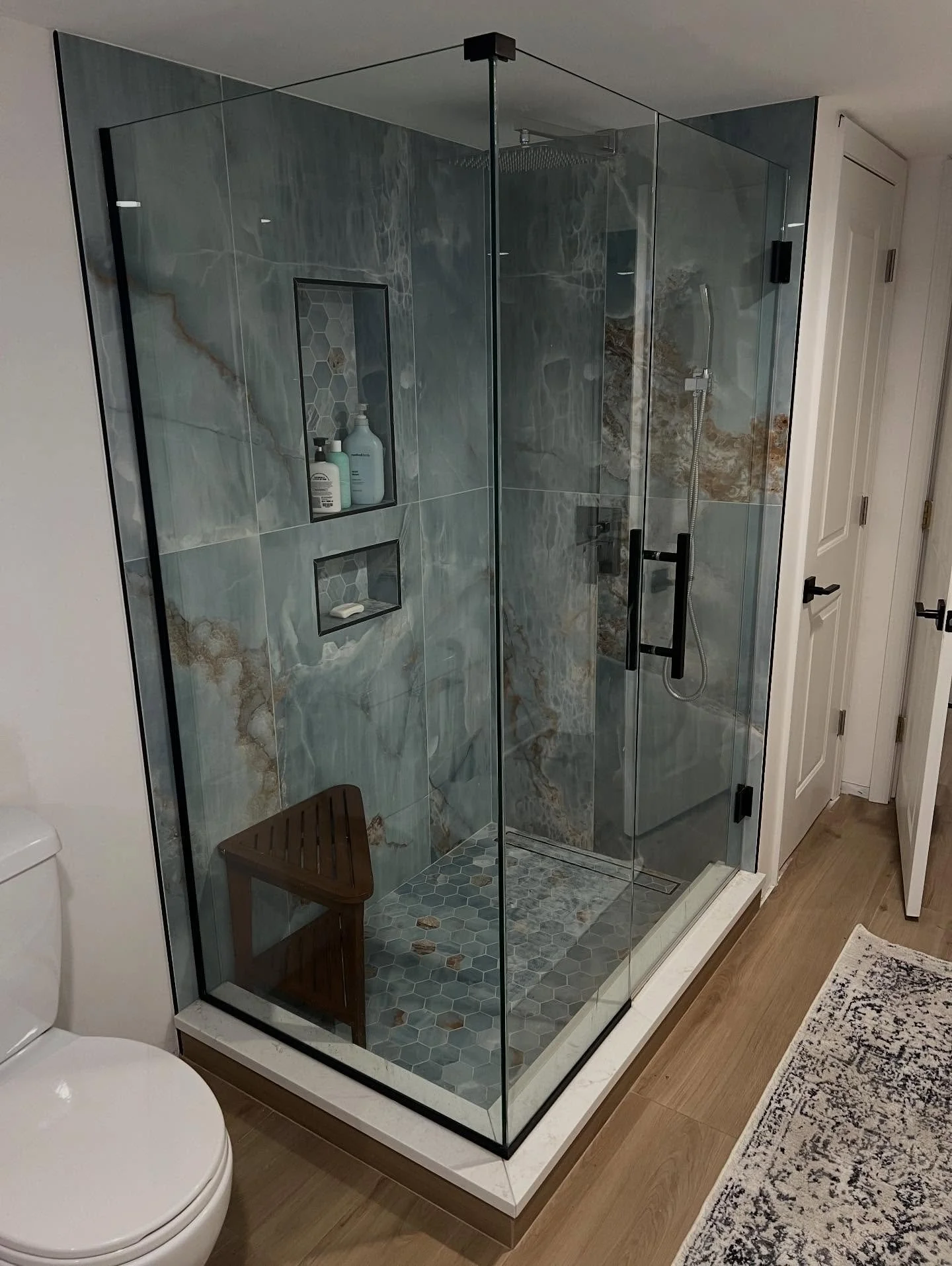 Basement bathroom reno just missing the final touches. Should we change the wall color?  #bathroomremodel #bathroomdesign #interiordesign #smallbusiness #bluetile