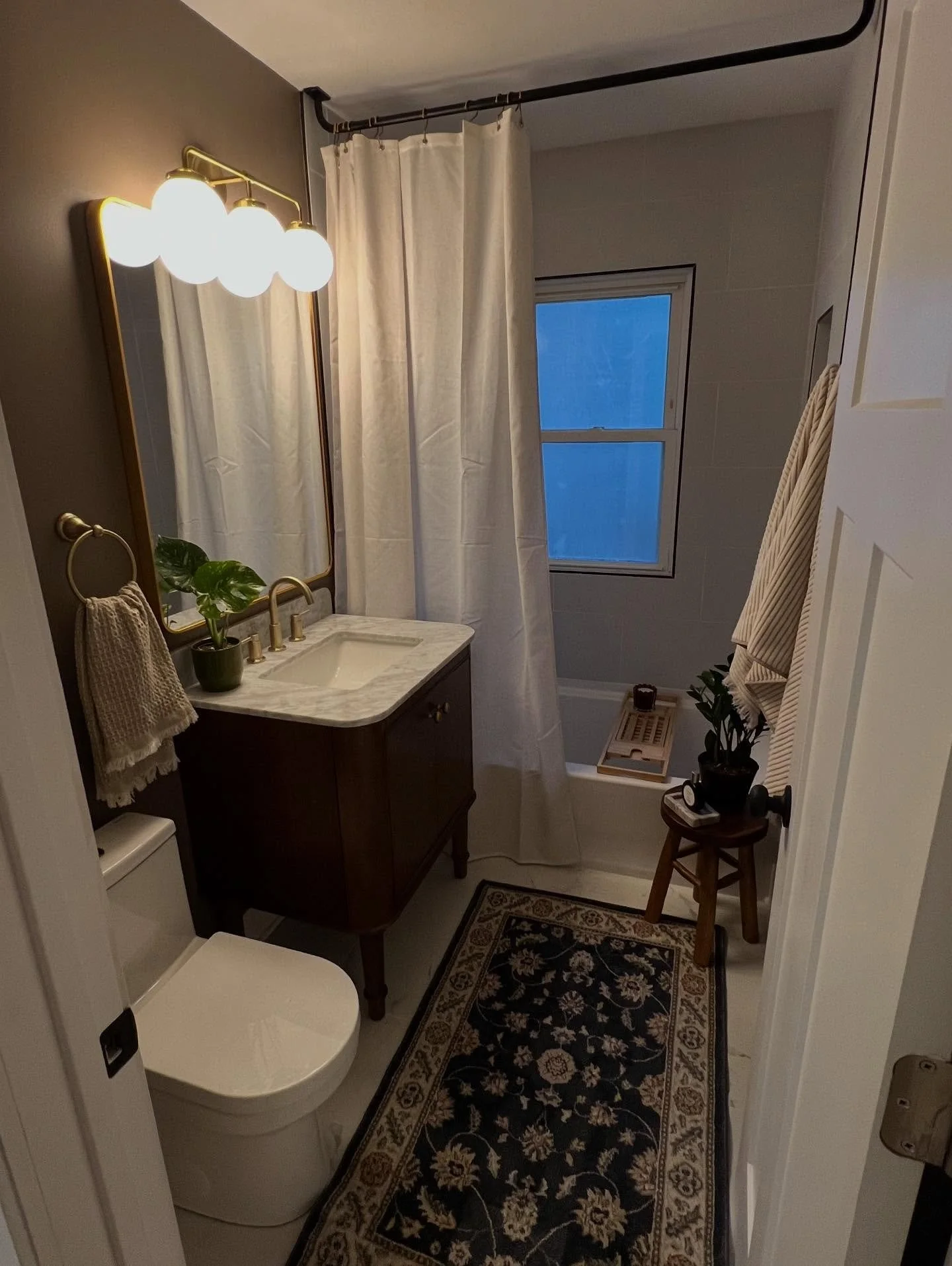 The stars of this bathroom for us are the vanity and the paint color. We are loving cozy browns. Yay bathroom renovation!  #bathroomreno #bathroomdesignideas #smallbusiness