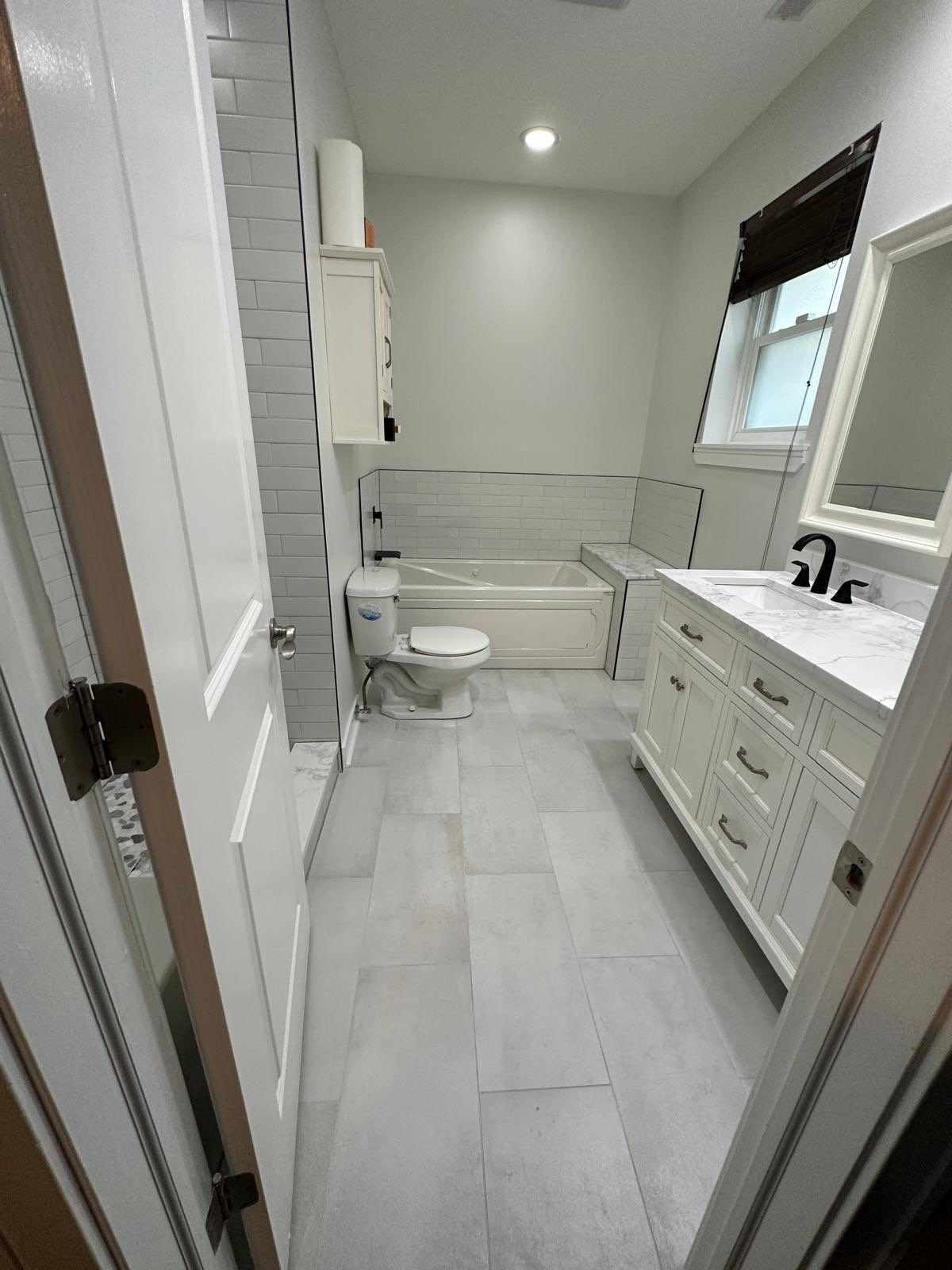 primary bath renovation for white neutral bathroom with white subway tile, recessed niche, marble floor tile, bathtub bench and subway tile bathtub surround, black hardware
interior designer chicago
interior design chicago
kitchen designer chicago
ba