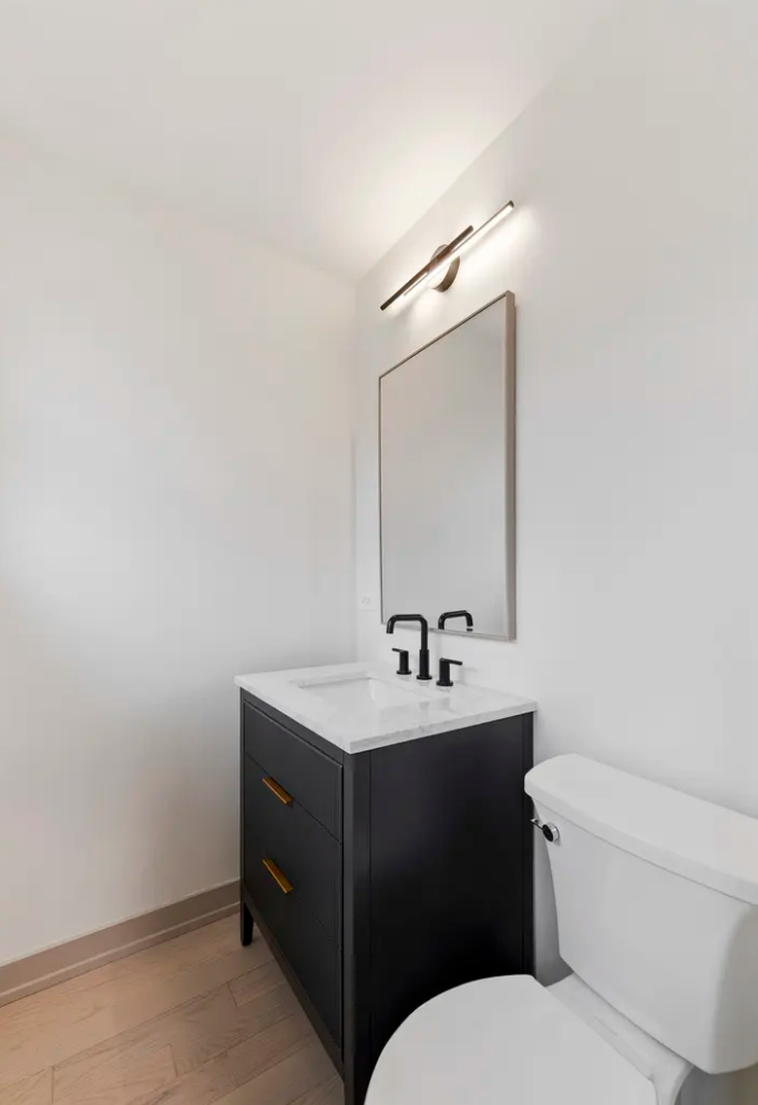 full home interior design and renovation in scandinavian minimal style with white oak floors, white oak cabinets, white quartz countertops and full quartz backsplash, appliance selection, lighting plans and schedules, arched hallway entries, front do