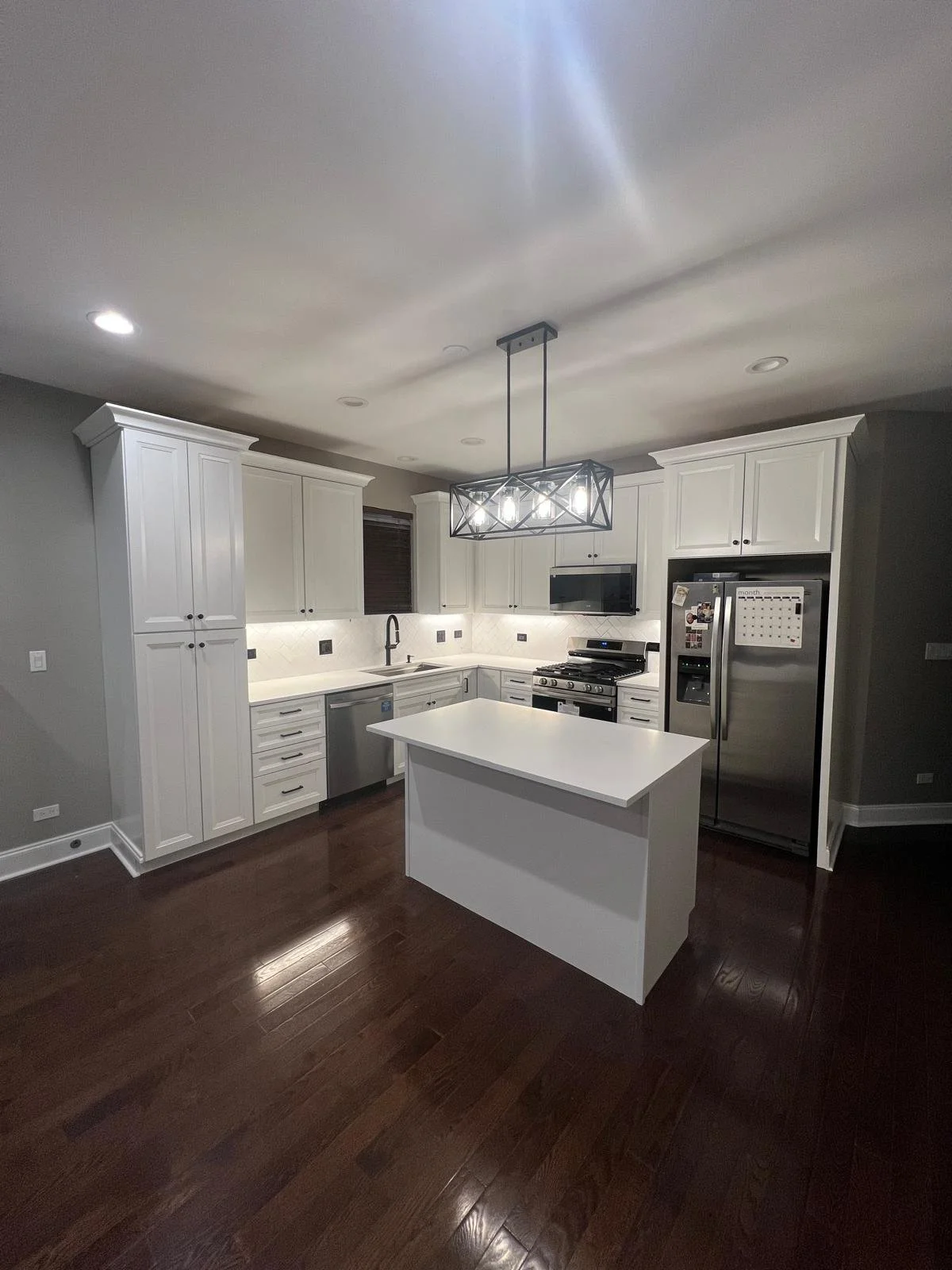 kitchen renovation in garden unit - white shaker cabinets, white subway tile in herringbone tile installation pattern, white quartz countertop, black hardware
interior designer chicago
interior design chicago
kitchen designer chicago
bathroom designe