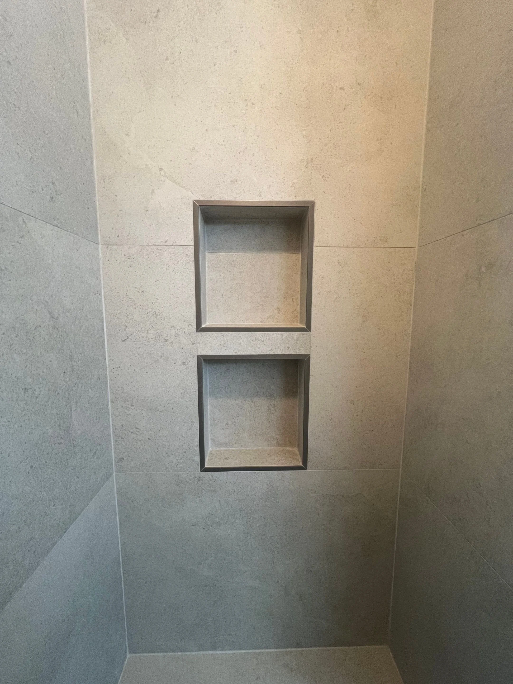 shower after renovation with stone-look porcelain time in large format with two recessed shower niches and one bench, new frameless glass door
Interior Designer - Chicago
interior design chicago
kitchen designer chicago
bathroom designer chicago