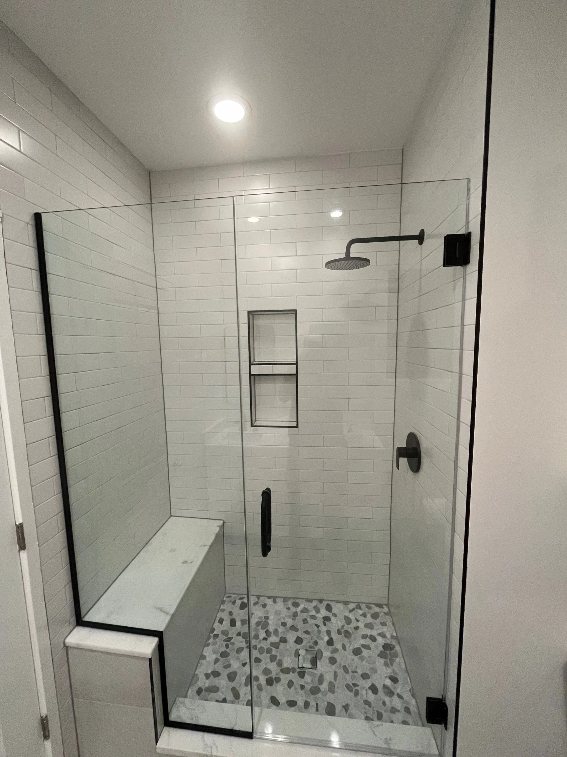 primary bath renovation for white neutral bathroom with white subway tile, recessed niche, marble floor tile, bathtub bench and subway tile bathtub surround, black hardware
interior designer chicago
interior design chicago
kitchen designer chicago
ba