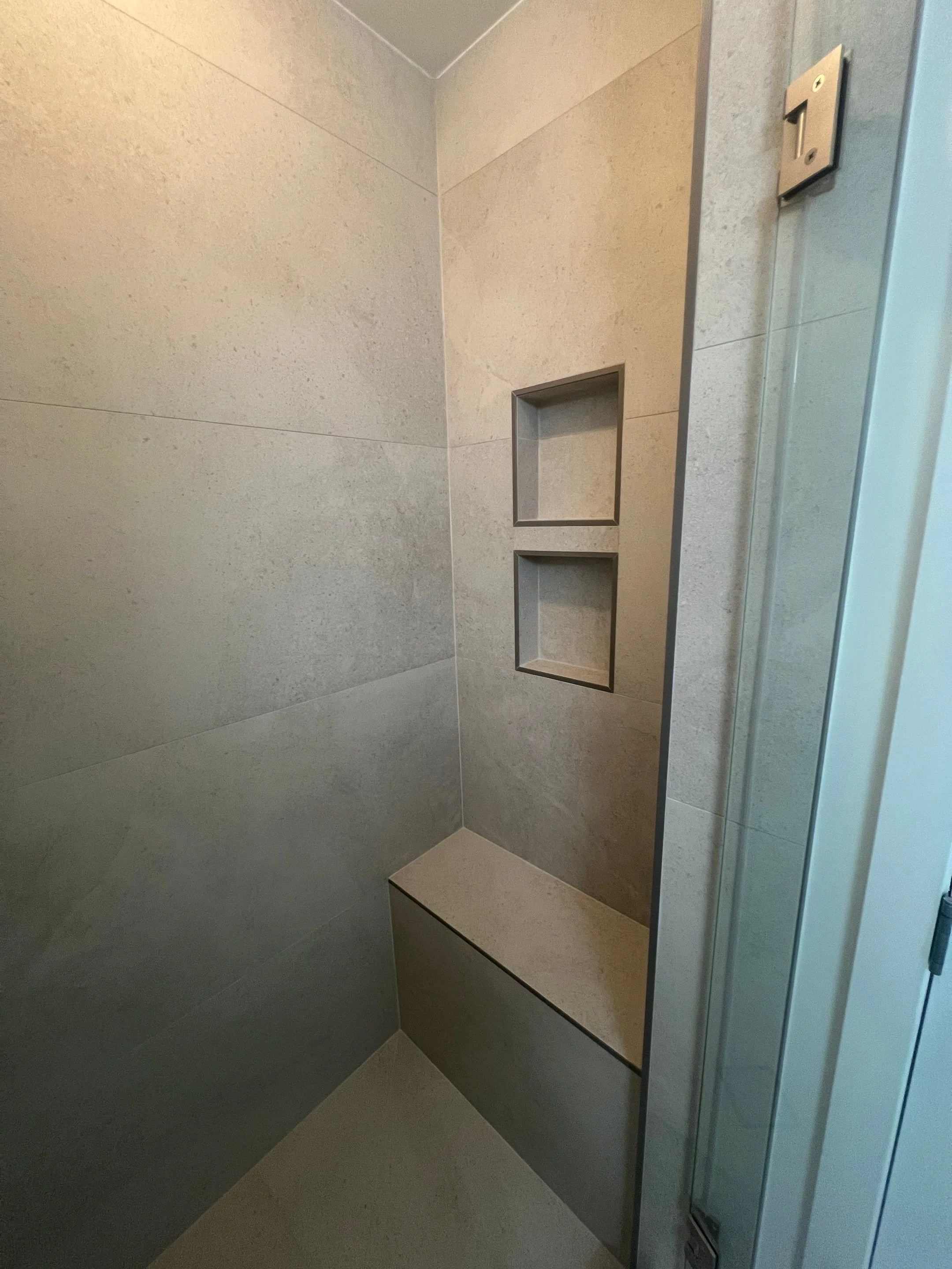 shower after renovation with stone-look porcelain time in large format with two recessed shower niches and one bench, new frameless glass door
Interior Designer - Chicago
interior design chicago
kitchen designer chicago
bathroom designer chicago