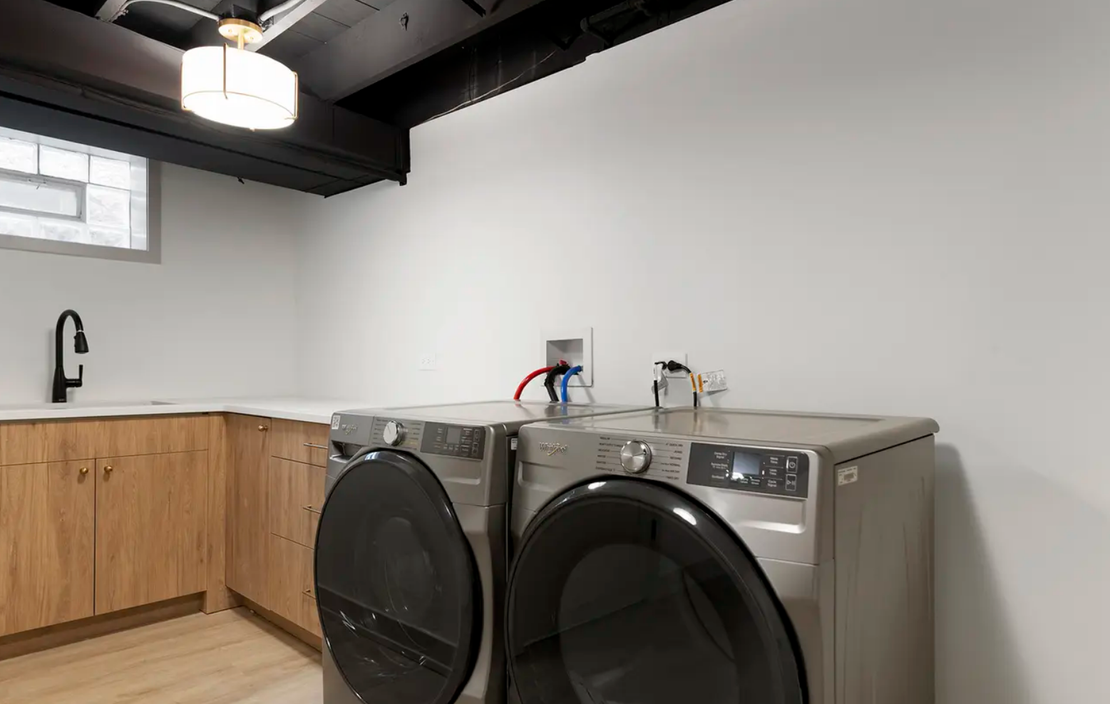 full home interior design and renovation in scandinavian minimal style with white oak floors, white oak cabinets, white quartz countertops and full quartz backsplash, appliance selection, lighting plans and schedules, arched hallway entries, front do