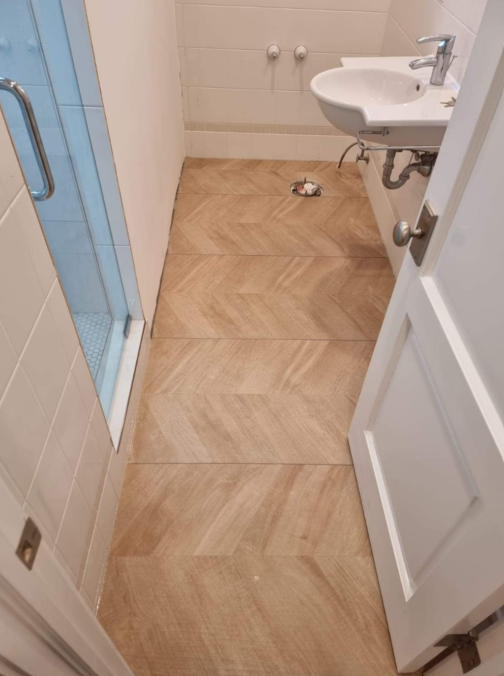 bathroom renovation with Scandinavian style, chrome plumbing, white subway tile, white penny tile, wood-looking tile on built-in bench and shelf with glass door
interior designer chicago
interior design chicago
bathroom design chicago