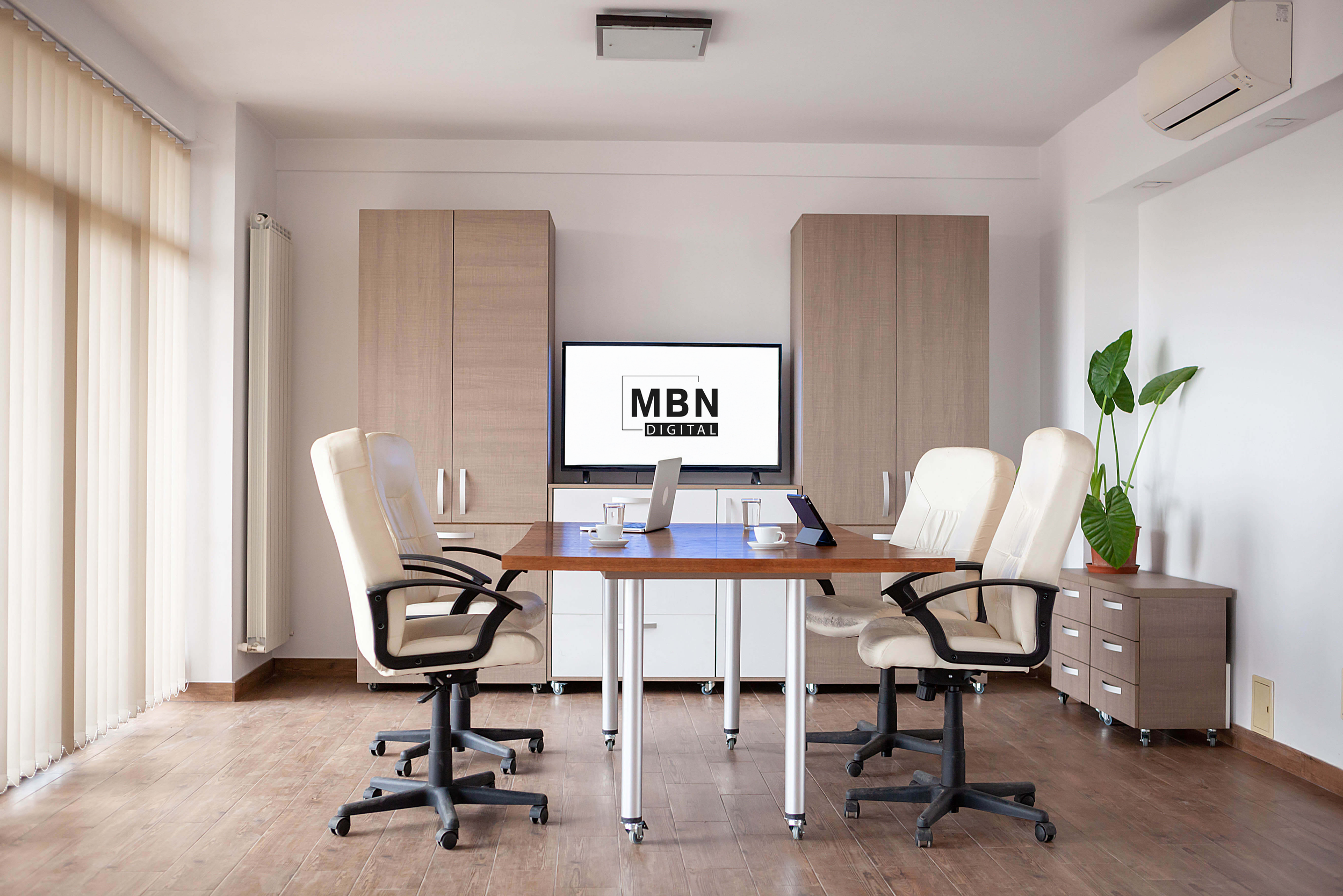 Modern conference room with MBN Digital displayed on a screen in the background