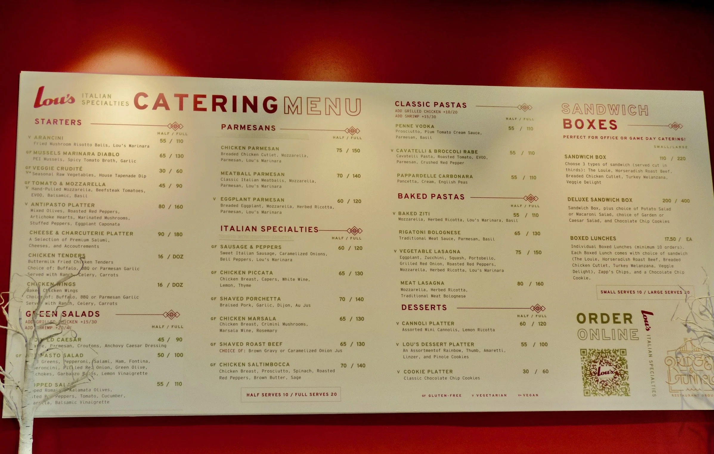 Louw's Italian catering menu featuring starters, parmesan, Italian specialties, classic pastas, baked pastas, sandwiches, box lunches, desserts, and order options.