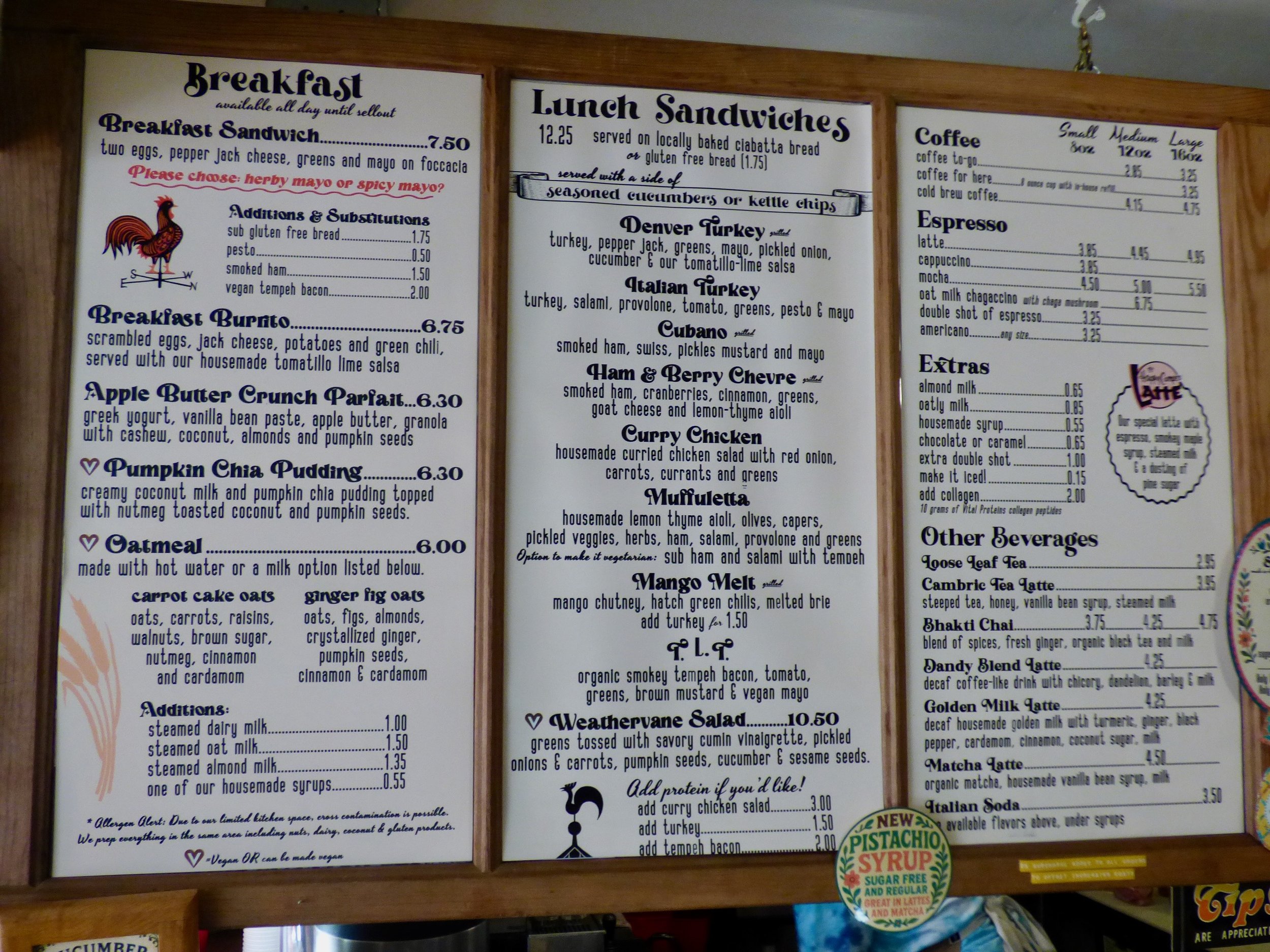 Menu board listing breakfast, lunch, coffee, espresso, and other beverages at a cafe at Weathervane Cafe, Denver, CO.