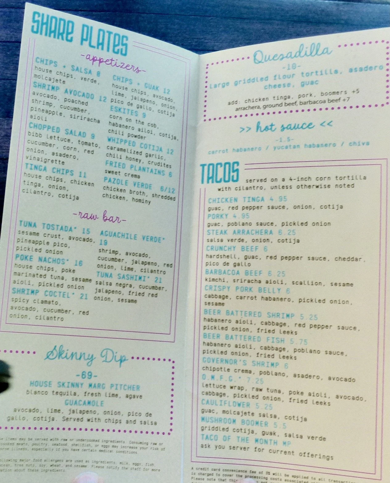 Menu featuring share plates, raw bar, and tacos with various descriptions and prices at Dos Santos, Denver, CO.