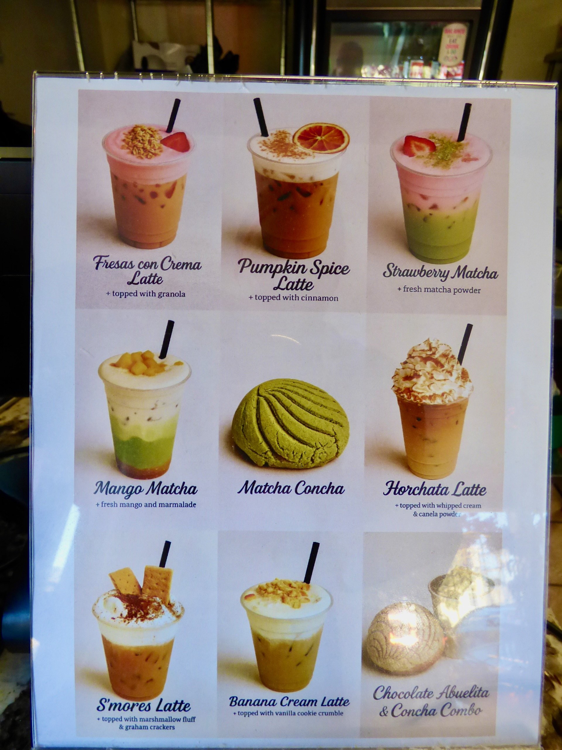 A menu featuring various drinks and a matcha concha at Oasis Cafe & Grill, Denver, CO 80205.