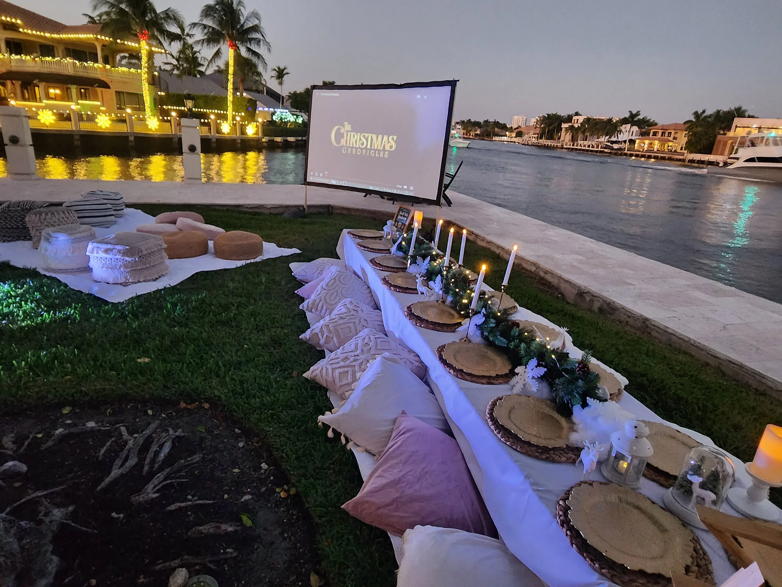 Outdoor movie night setup with large screen and cozy seating by KidsDreamFactory NYC