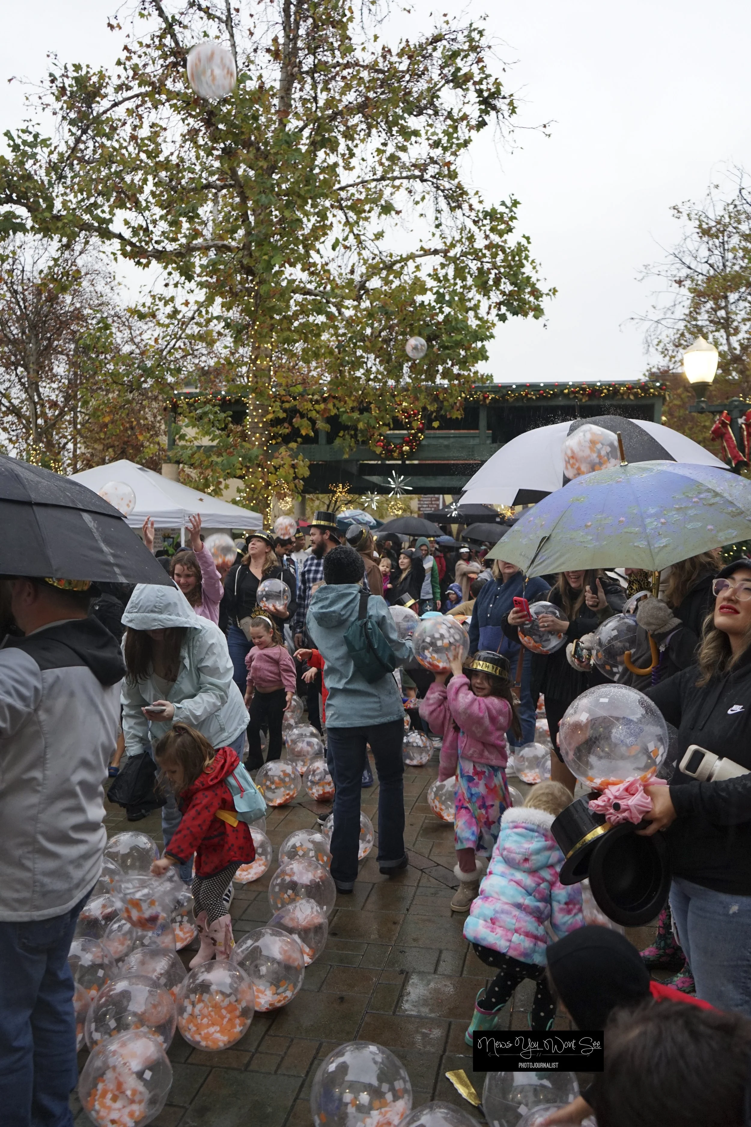  Kids and adults play with the beach balls as they fall during the annual beach ball drop at Ed Hales Park, Dec. 31, 2025. (photo by Brian Spears, Redlands Collective News) 