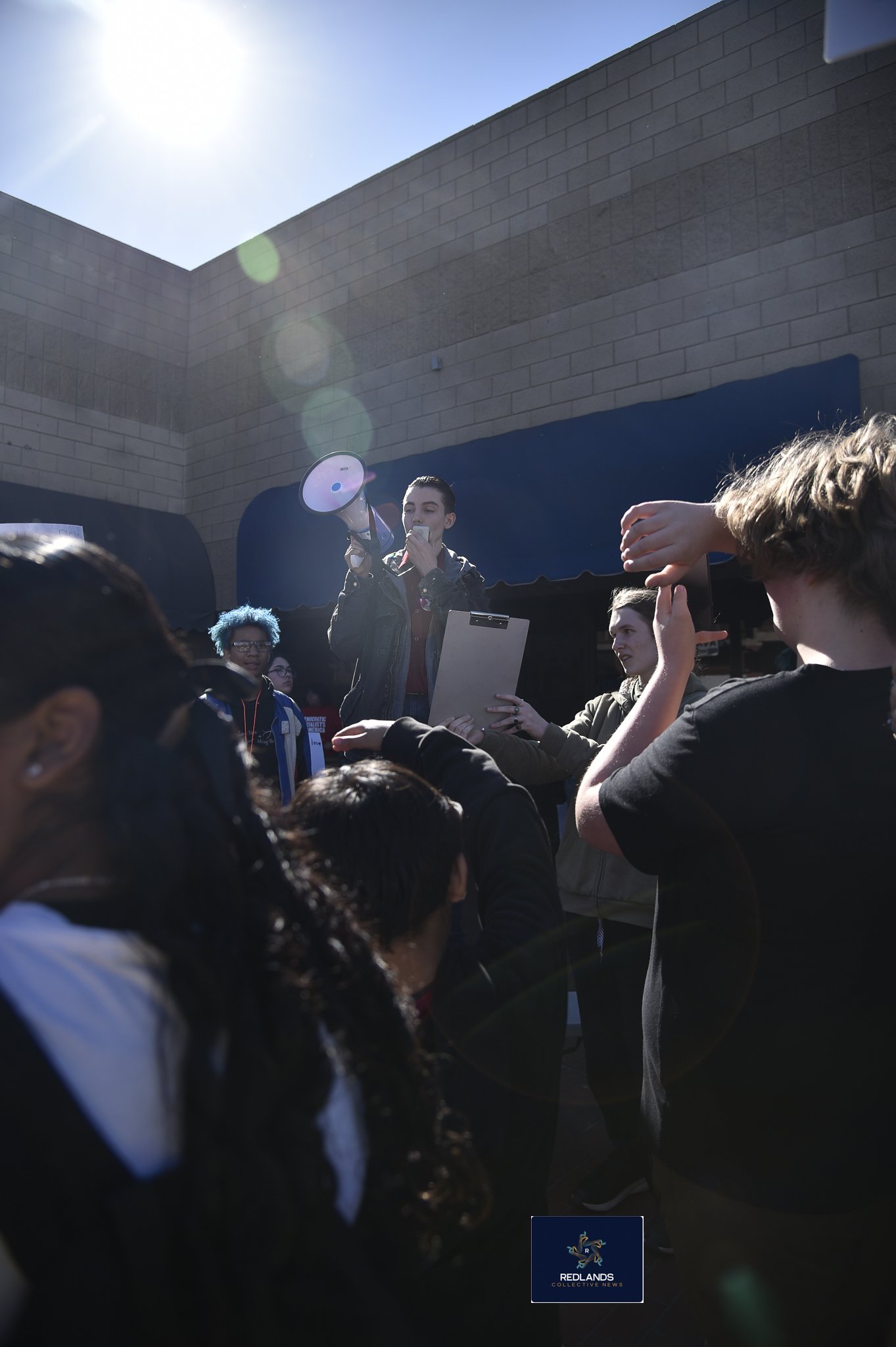  one of many students to speak out against ICE Feb. 13, 2026, in downtown Redlands (Photo by Brian Spears, Redlands News Collective)  
