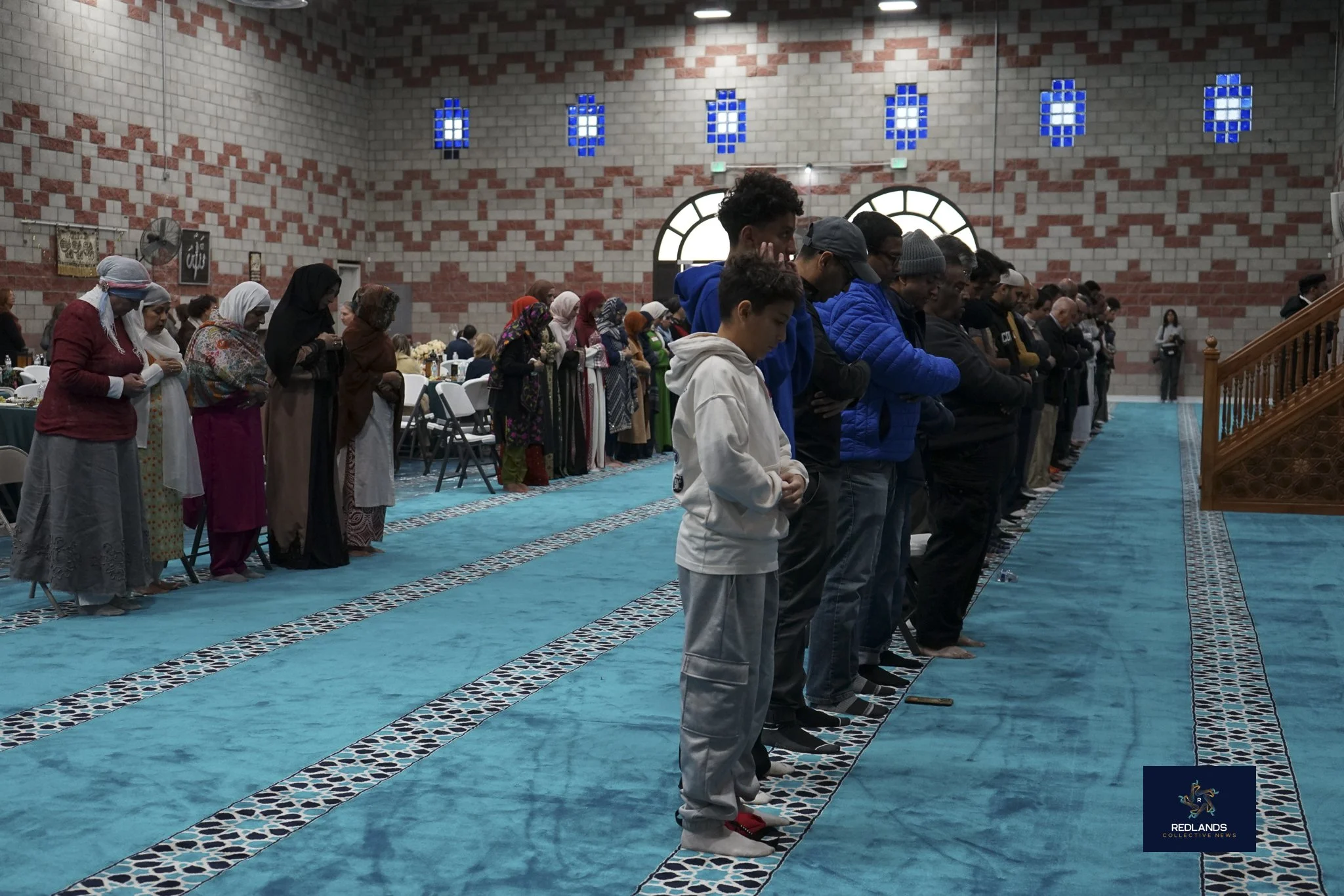  Men and woman pray during the call to the Zuhr warshop at sundown and the time they break the fast at the Interfaith Ramadan Iftar at The Islamic Community Center of Redlands on Feb. 22, 2026  (Photo by Brian Spears, Redlands News Collective) 