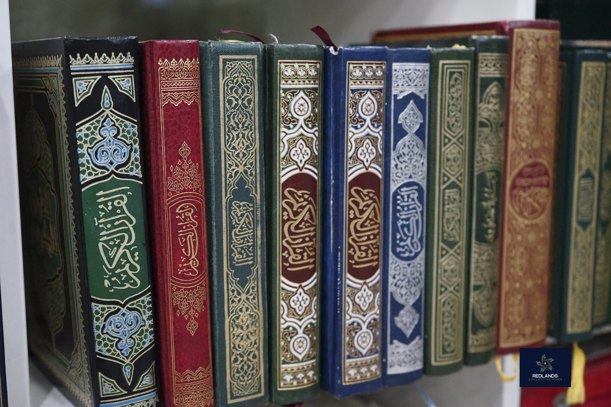  Qurans lined up at the Interfaith Ramadan Iftar at The Islamic Community Center of Redlands on Feb. 22, 2026  (Photo by Brian Spears, Redlands News Collective) 