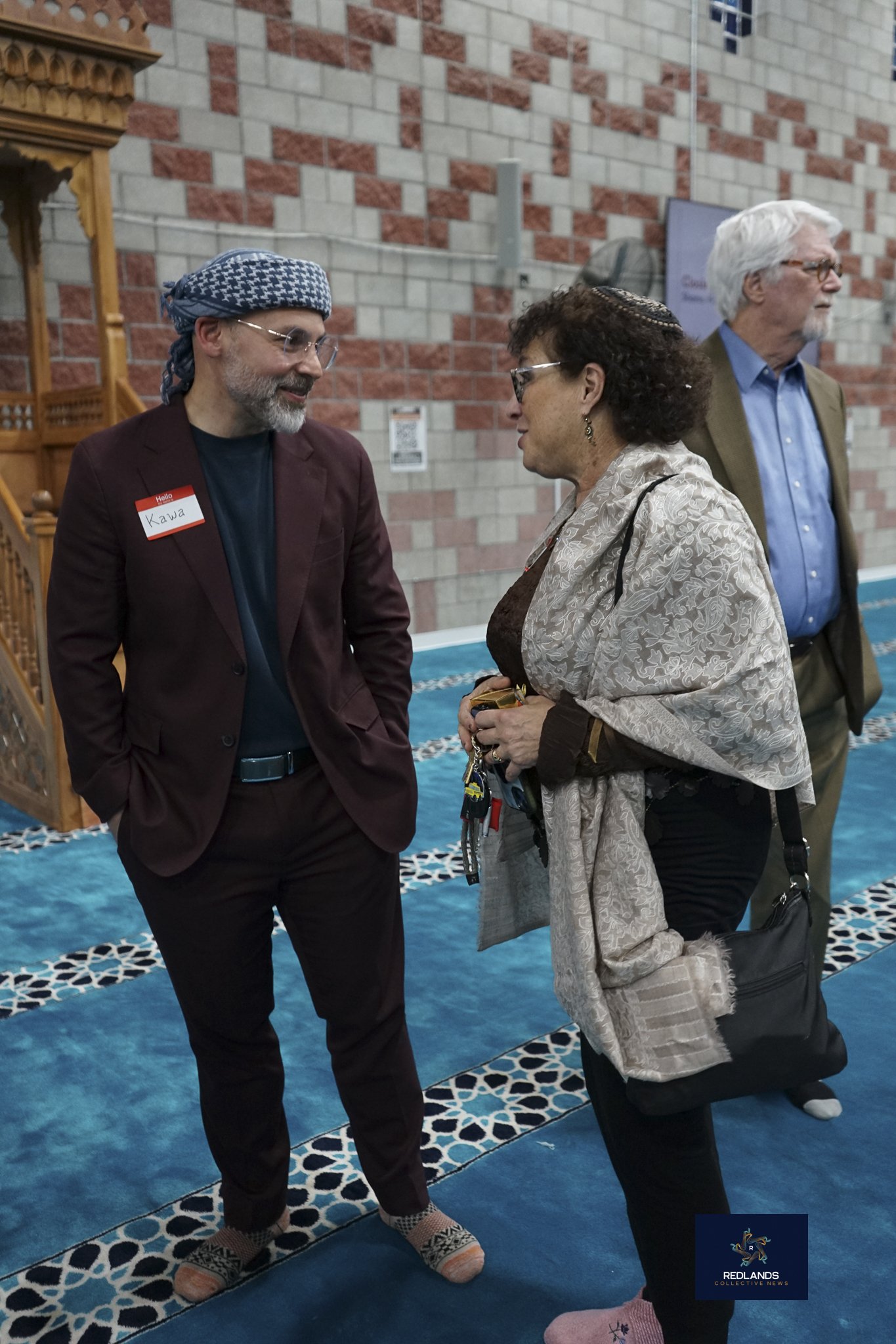  Kawa Shwaish and Rabbi Cantor Bern-Vogel speak at the Interfaith Ramadan Iftar at The Islamic Community Center of Redlands on Feb. 22, 2026  (Photo by Brian Spears, Redlands News Collective) 