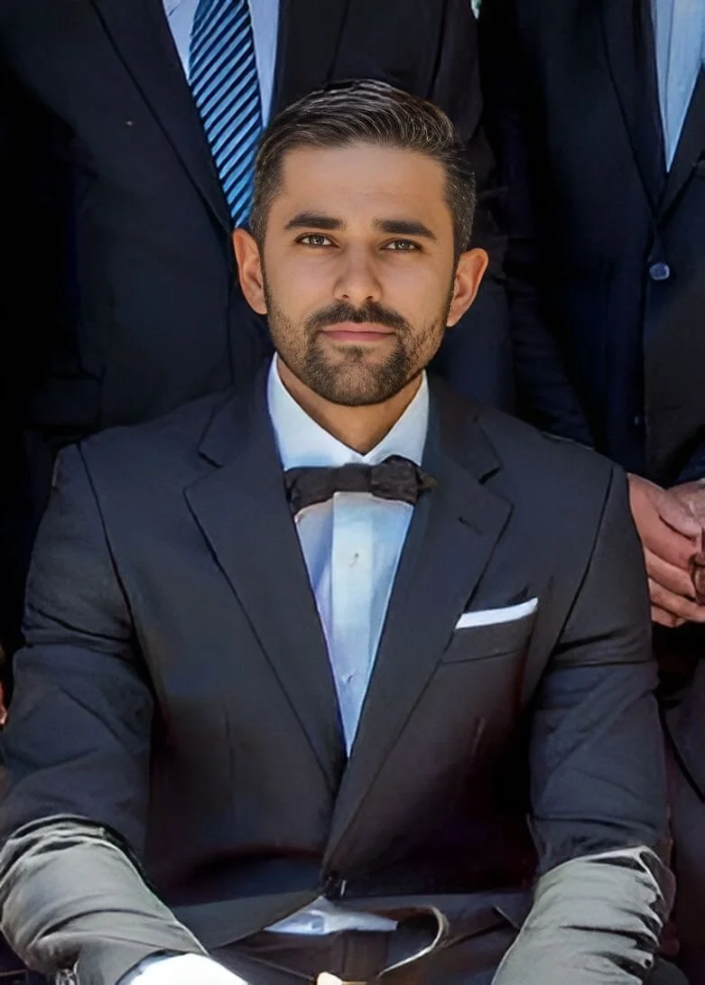 Adam Green, founder of Lateral Joinery, wearing a suit and bow tie